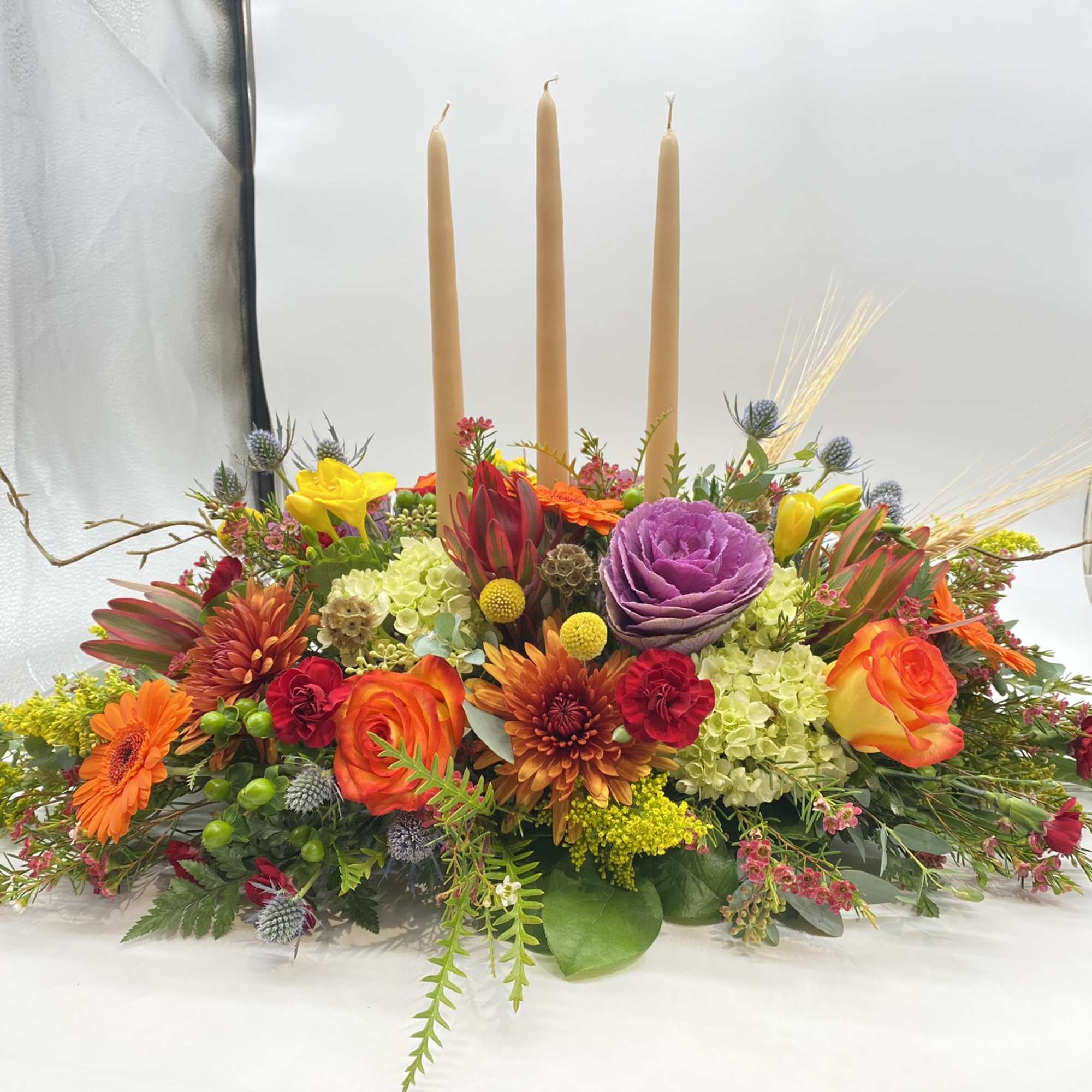 This centerpiece is adorned with all your Fall favorite flowers and tones...
The