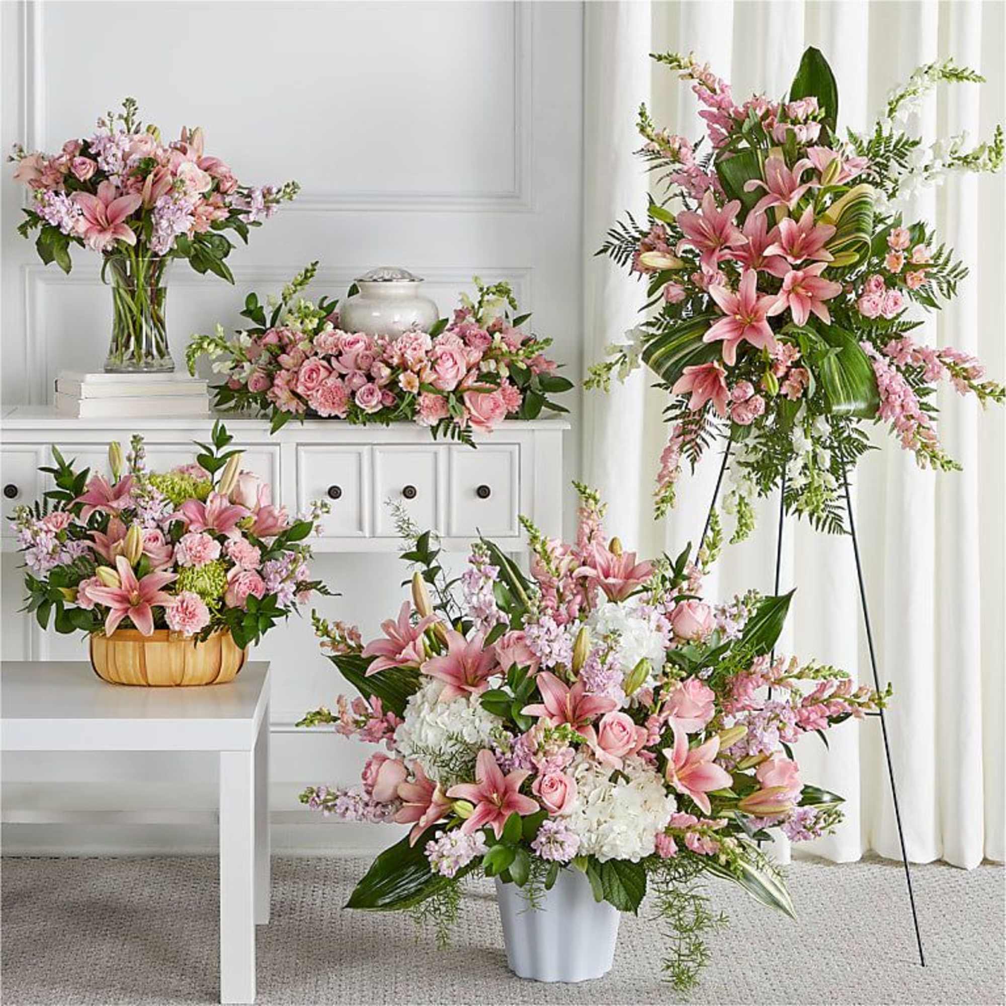 BOUNTIFUL FUNERAL BLOOMS BUNDLES

This prim pink set features elegant traditional arrangements fit