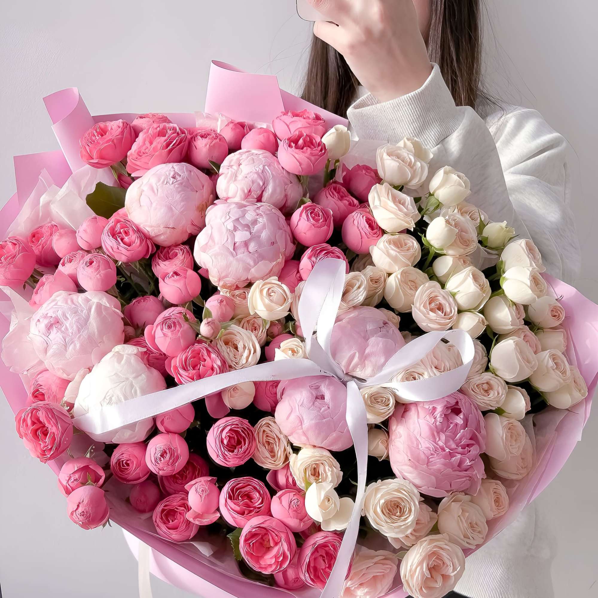 A luxurious fusion of soft blush peonies, delicate spray roses, and classic