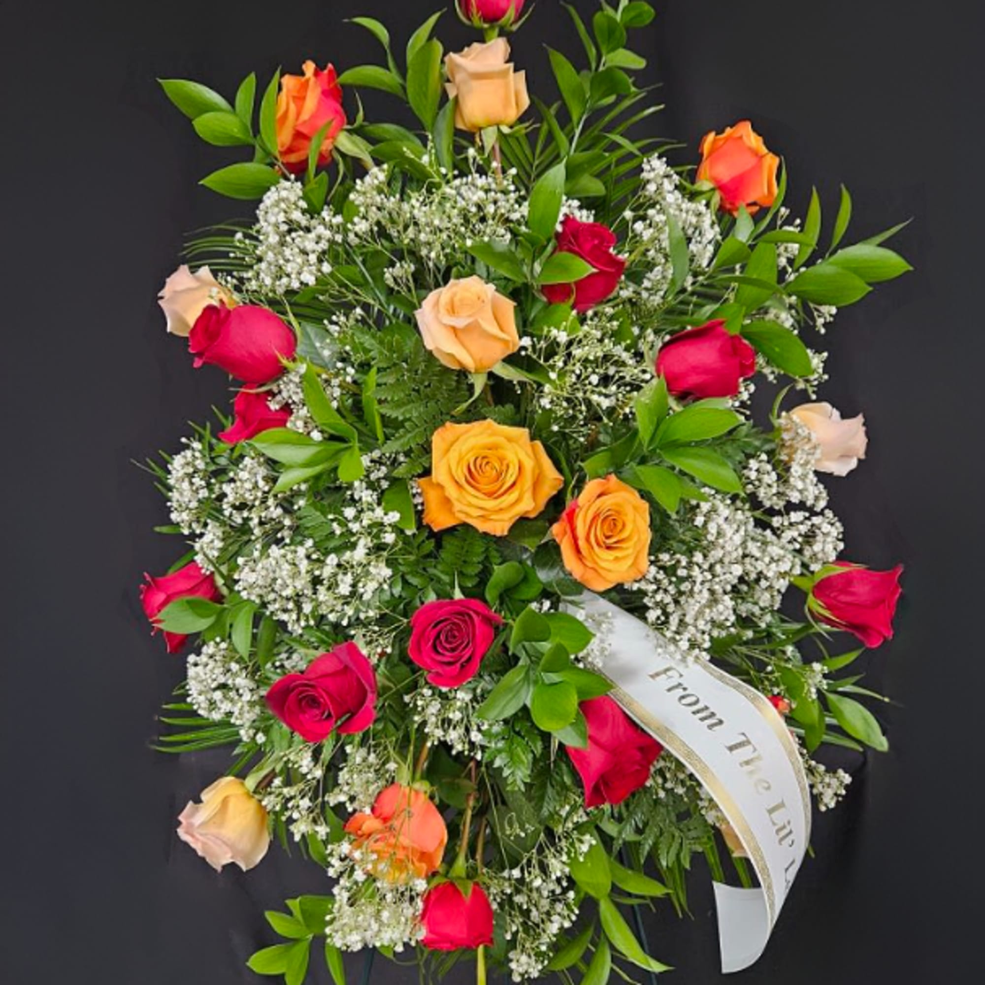 An arrangement of 24 (Standard), 36 (Deluxe), or 48 (Premium) colored roses