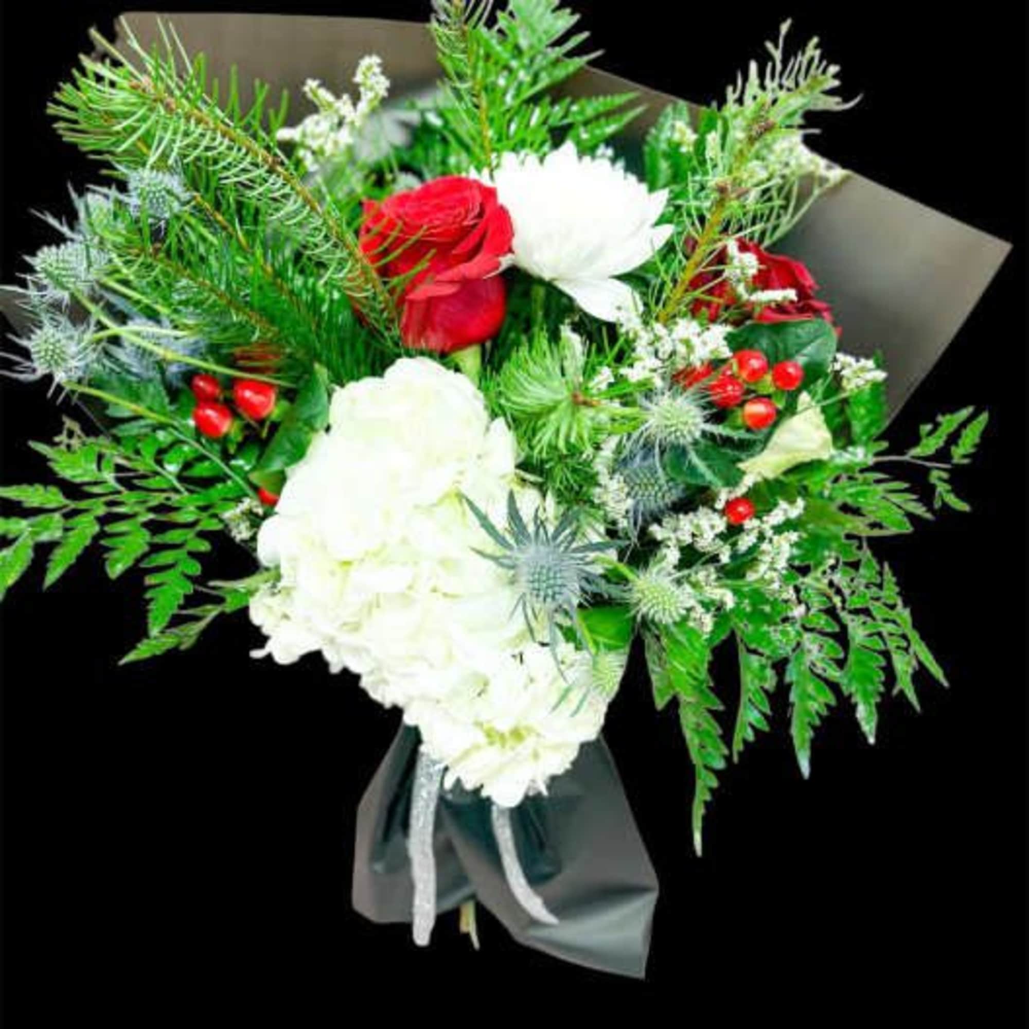Wrapped holiday bouquet with the freshest seasonal blooms. 