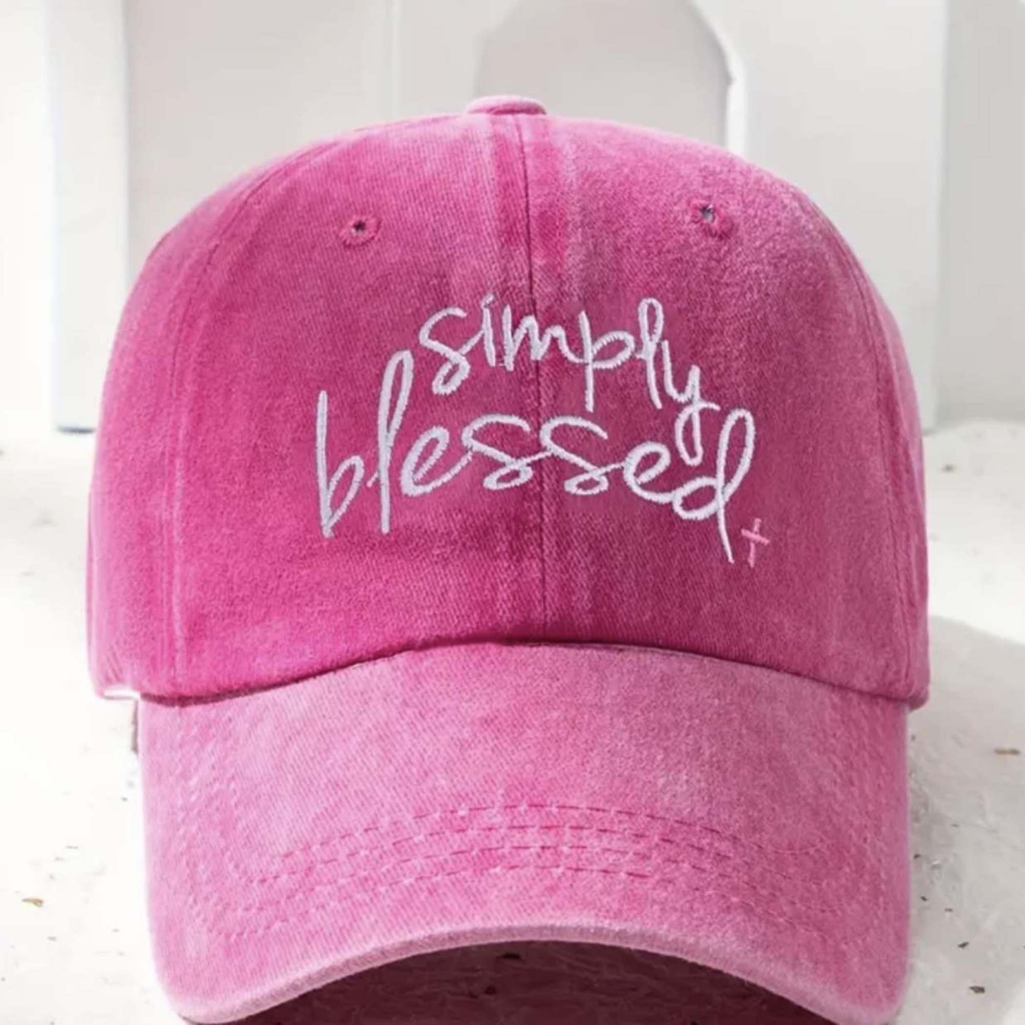 Bright, cheerful, and inspiring, this hot pink cap declares &ldquo;Simply Blessed&rdquo; in