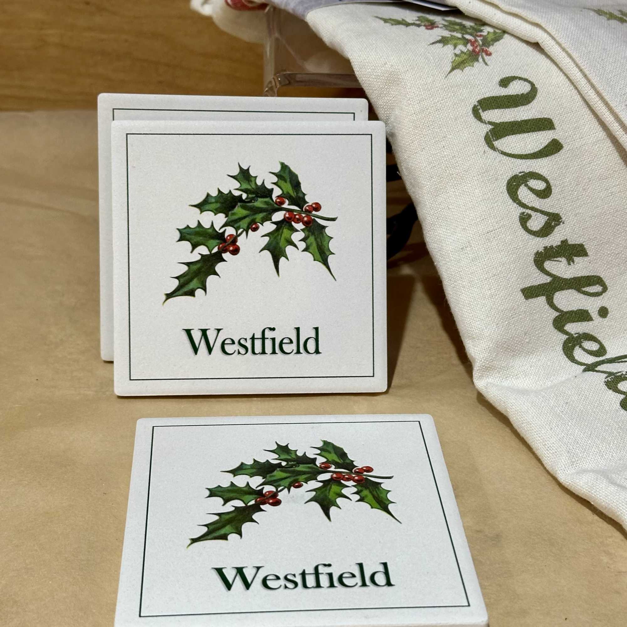 Two Holiday themed hand towels paired with 4 tile coasters and 2