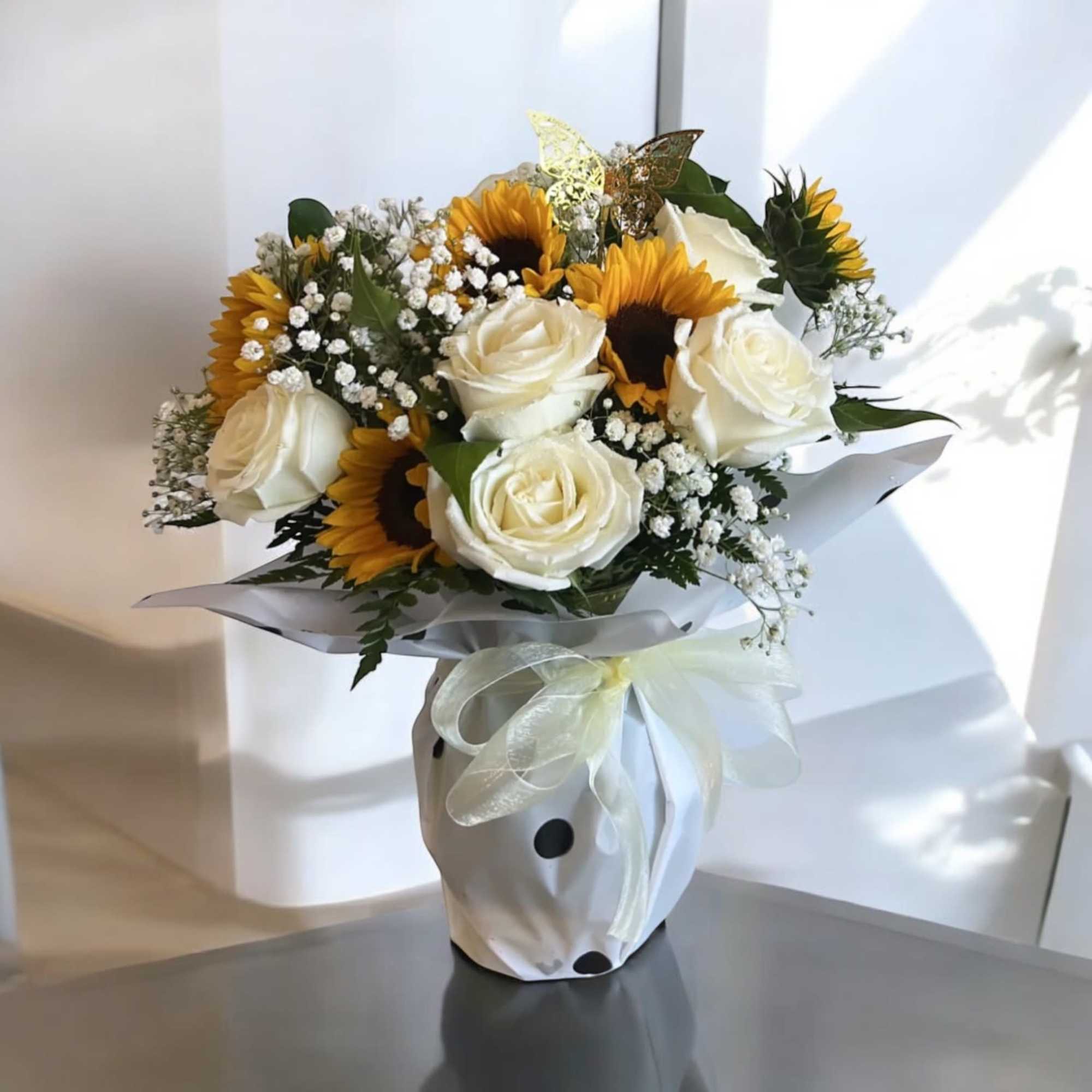 Sunflowers &amp; Roses Arrangment 

Vase may be wapped in a different paper