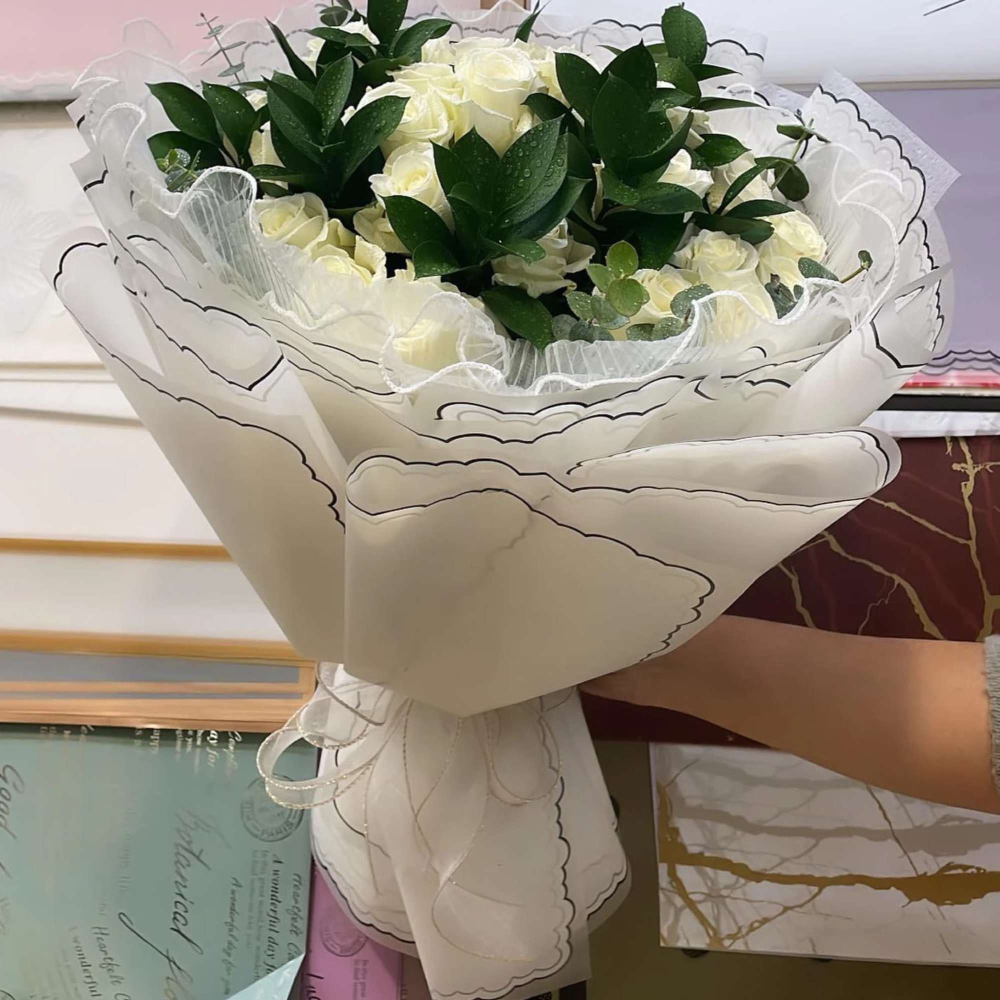 Introducing our exquisite bouquet of white roses, a timeless symbol of purity