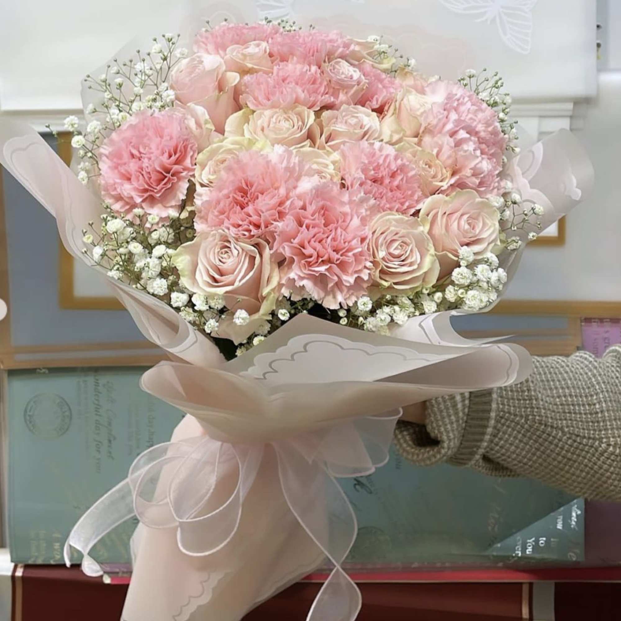 Introducing our exquisite bouquet of pink carnations and baby&#039;s breath, a