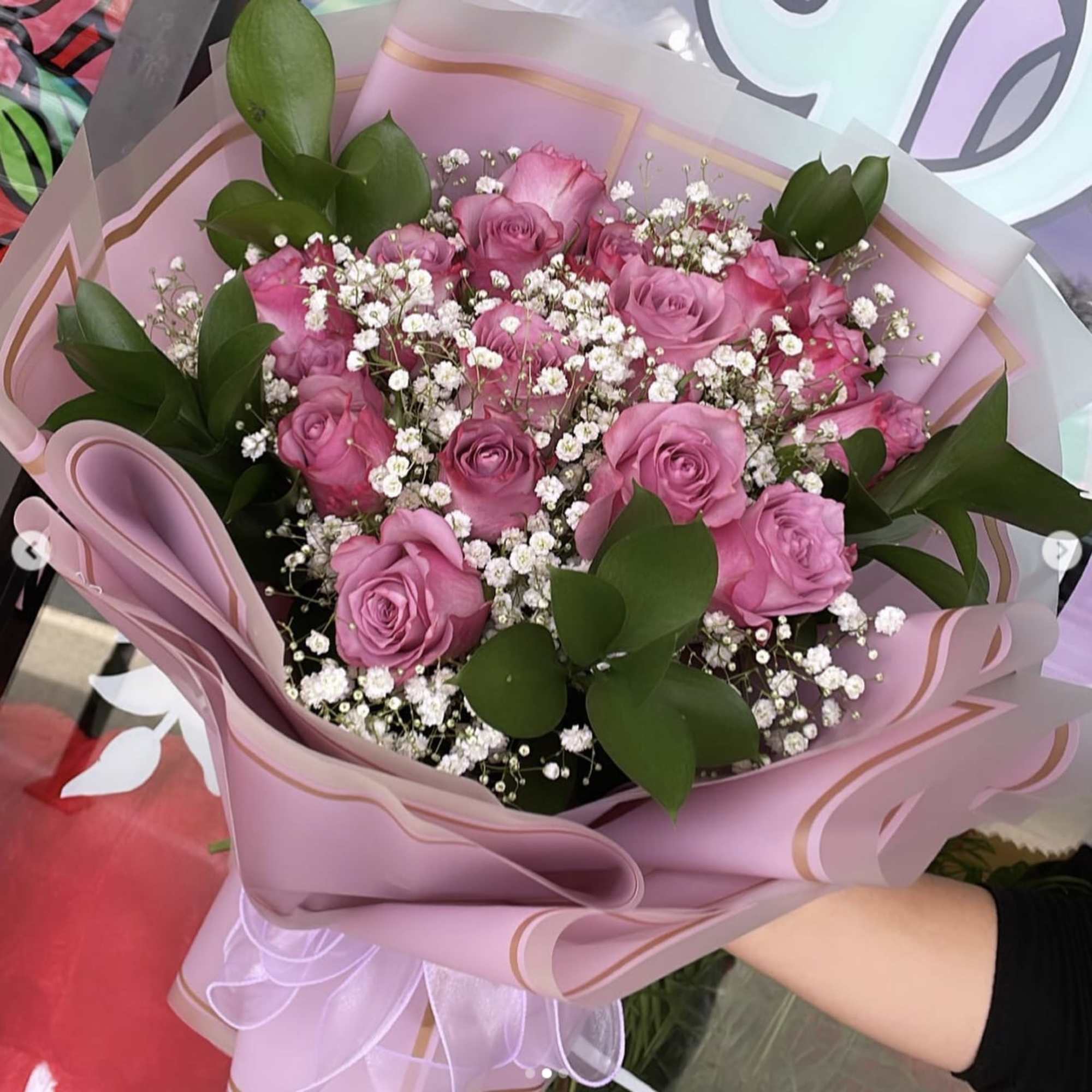 Introducing our exquisite bouquet of purple roses, a symbol of elegance and