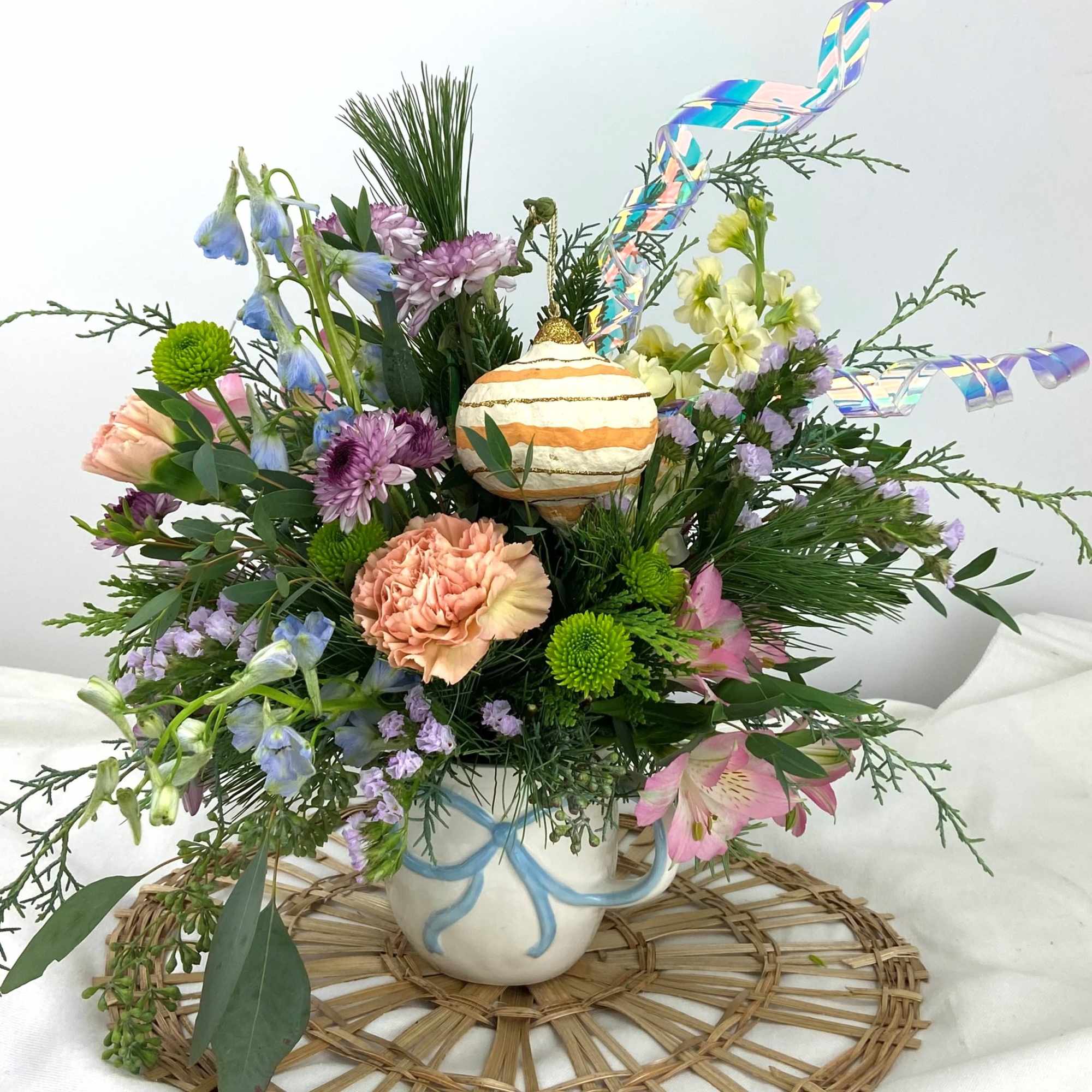 Winter Pastels in a Bow Mug with a keepsake ornament! 
Colors may