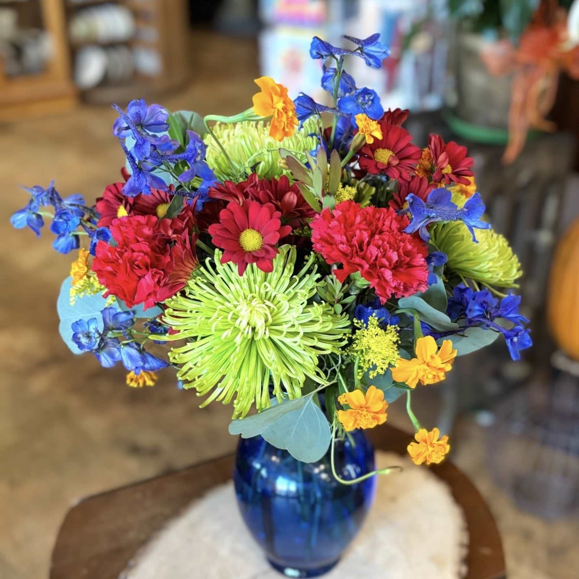 Like a smile in bloom, this arrangement overflows with happy color. Bright