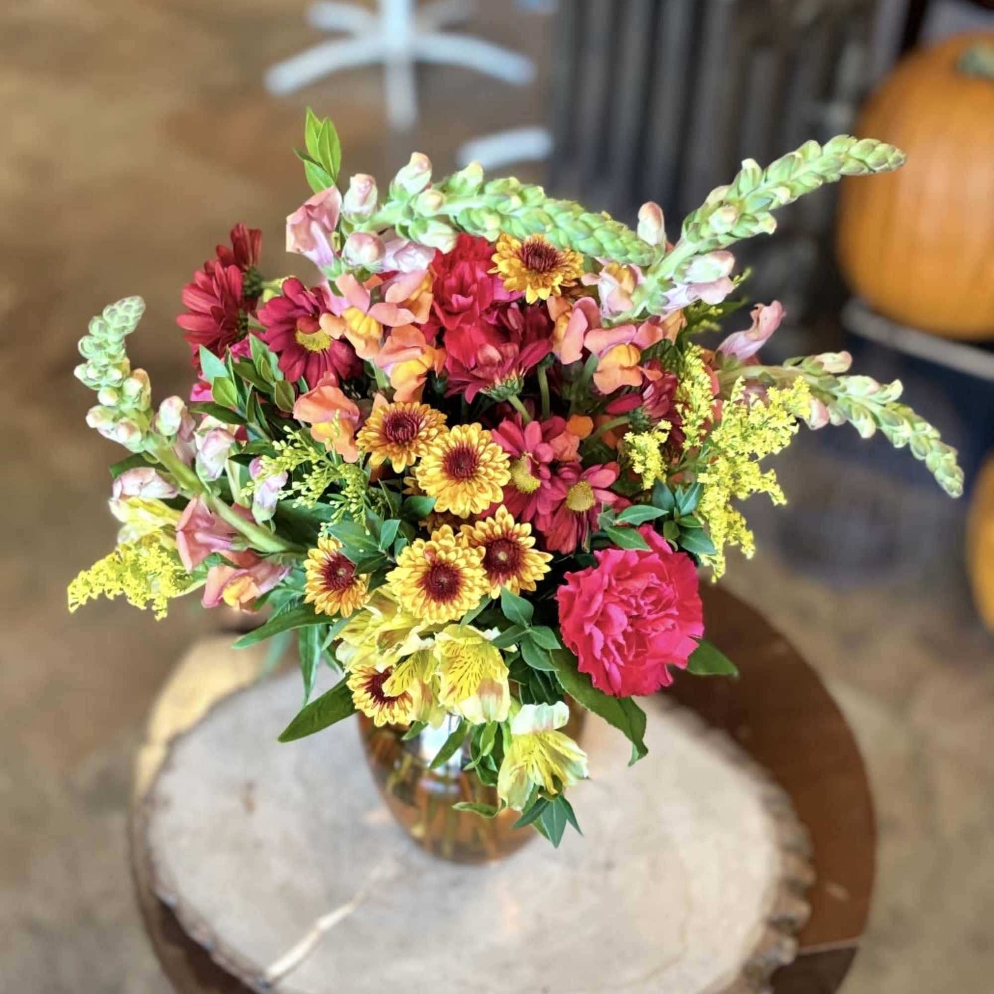 Give a warm welcome with this cheerful blend of autumn tones. Orange