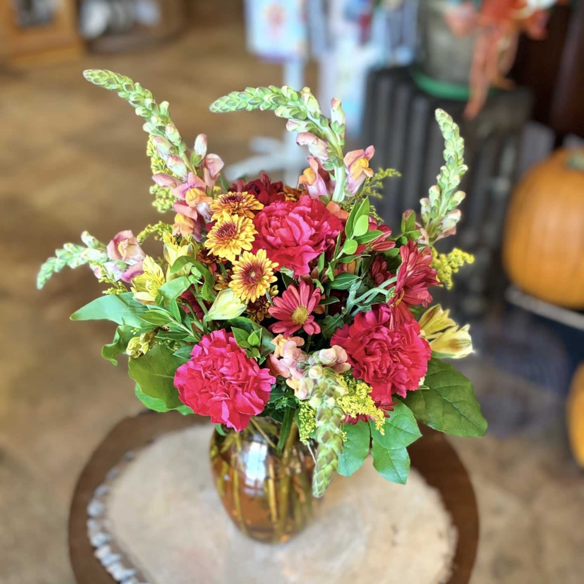 Give a warm welcome with this cheerful blend of autumn tones. Orange