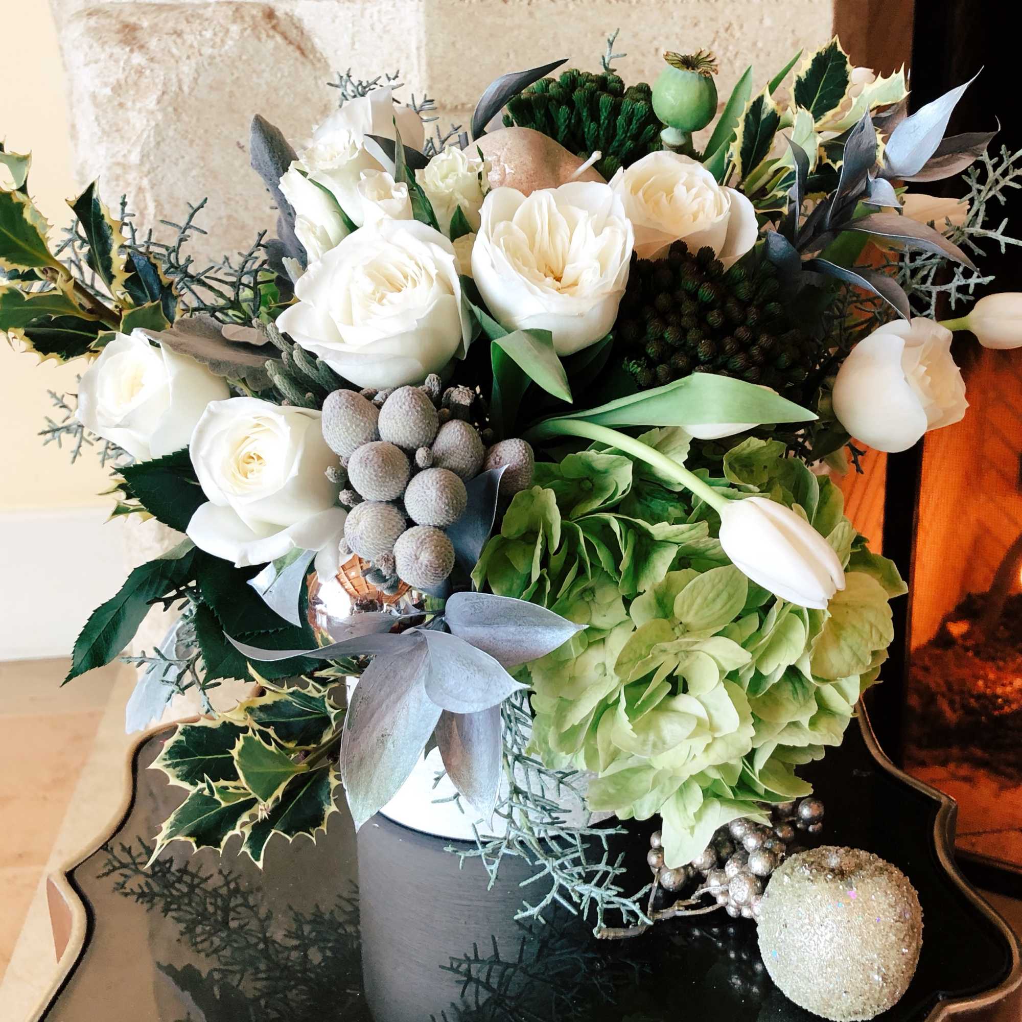 A special and very classy design with crisp white tulips, lighter green