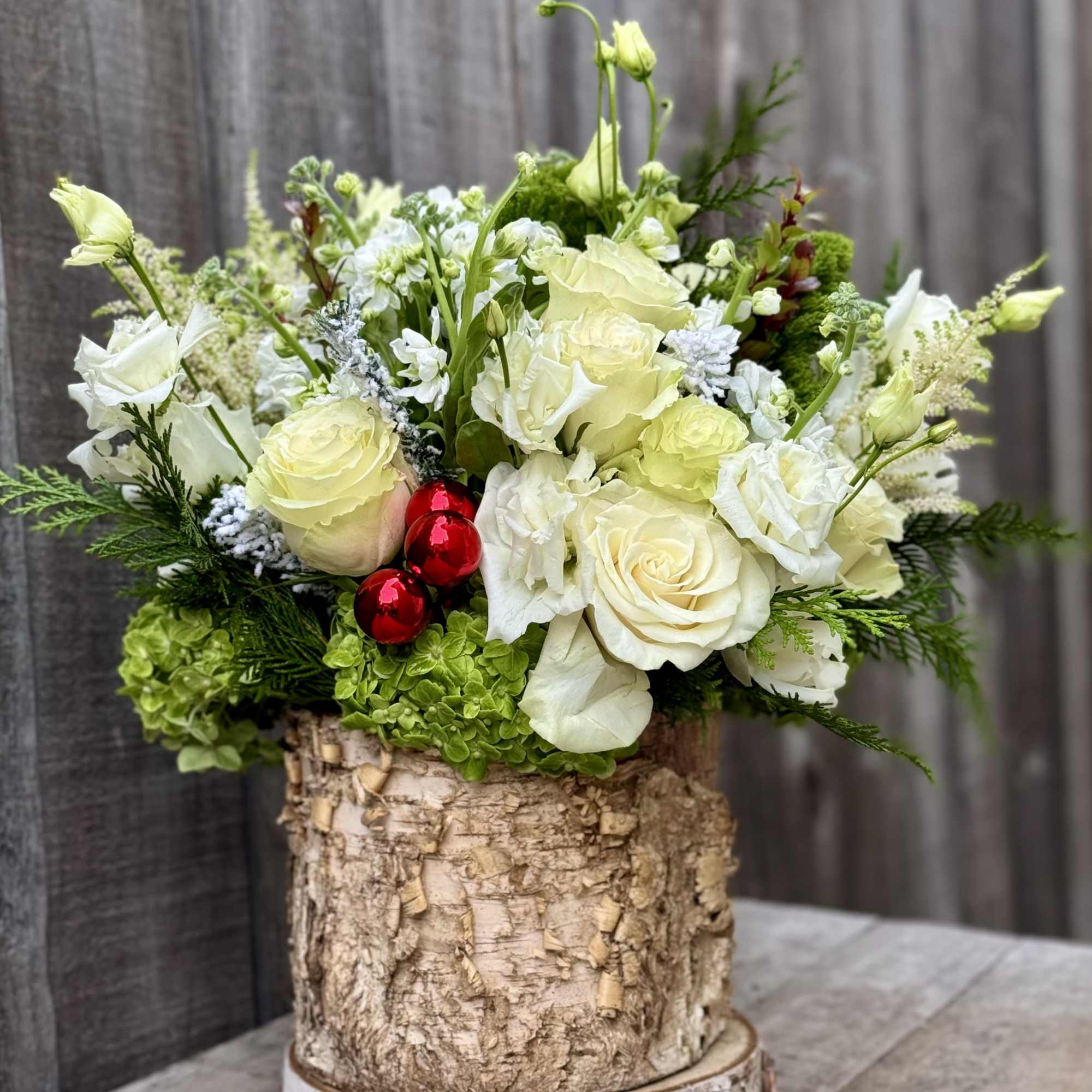 A beautiful whites and greens design nestled in a 6x7 wooden container!
Very