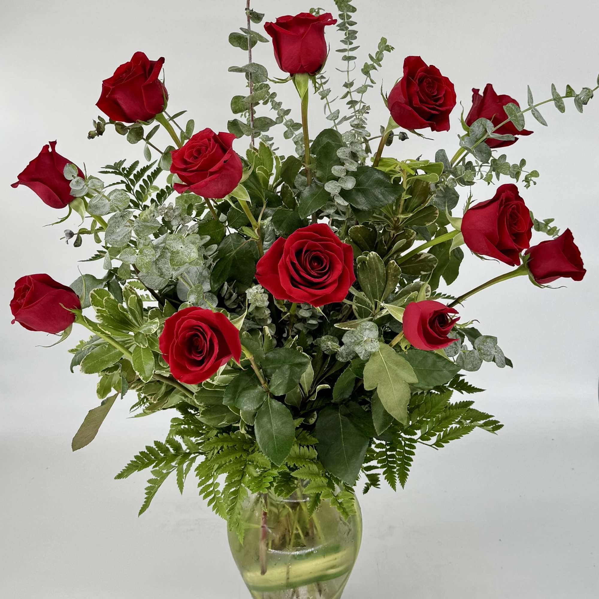 Immerse your loved one in timeless elegance with a dozen long-stemmed red