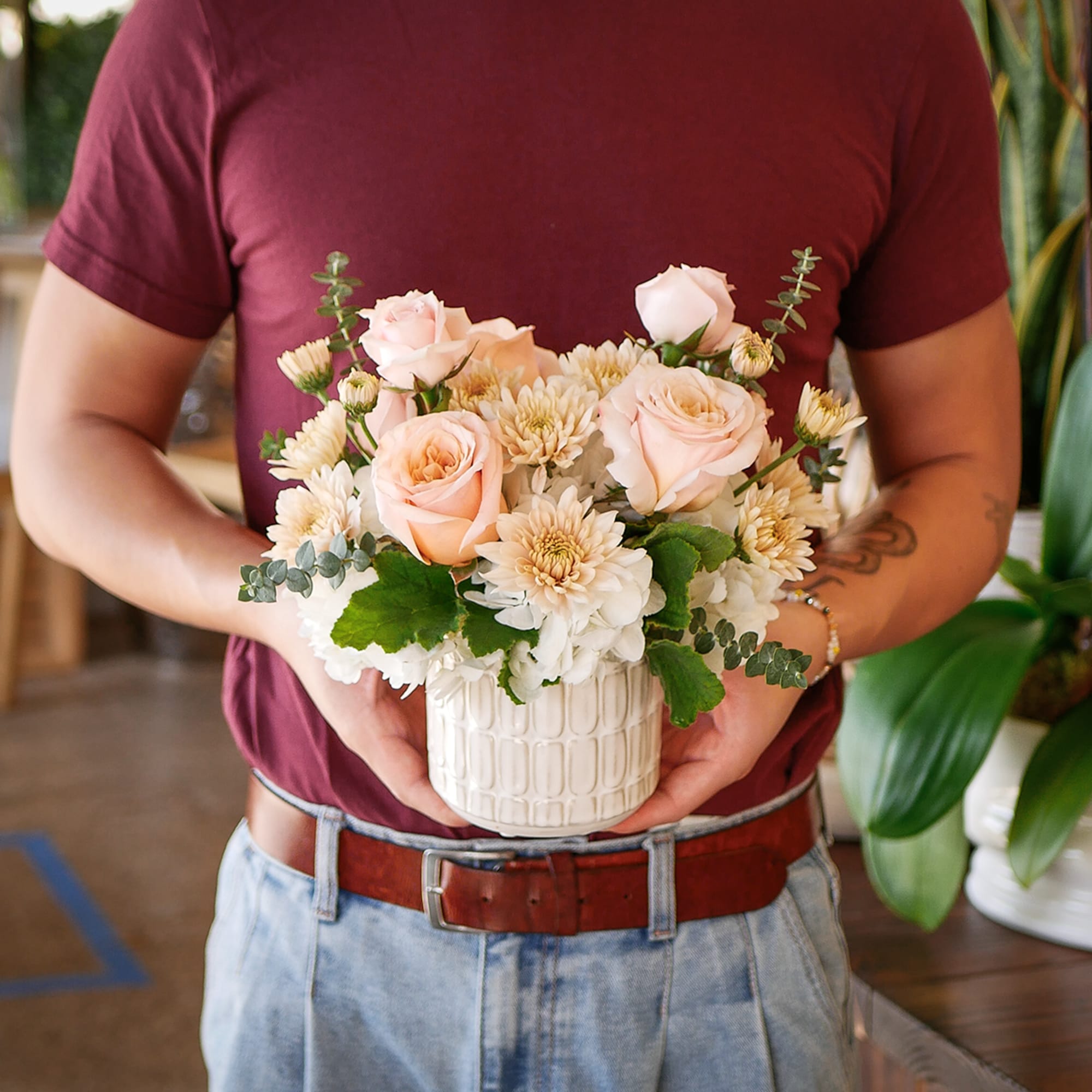 This darling arrangement features a soft peach design with hydrangeas, roses, mums