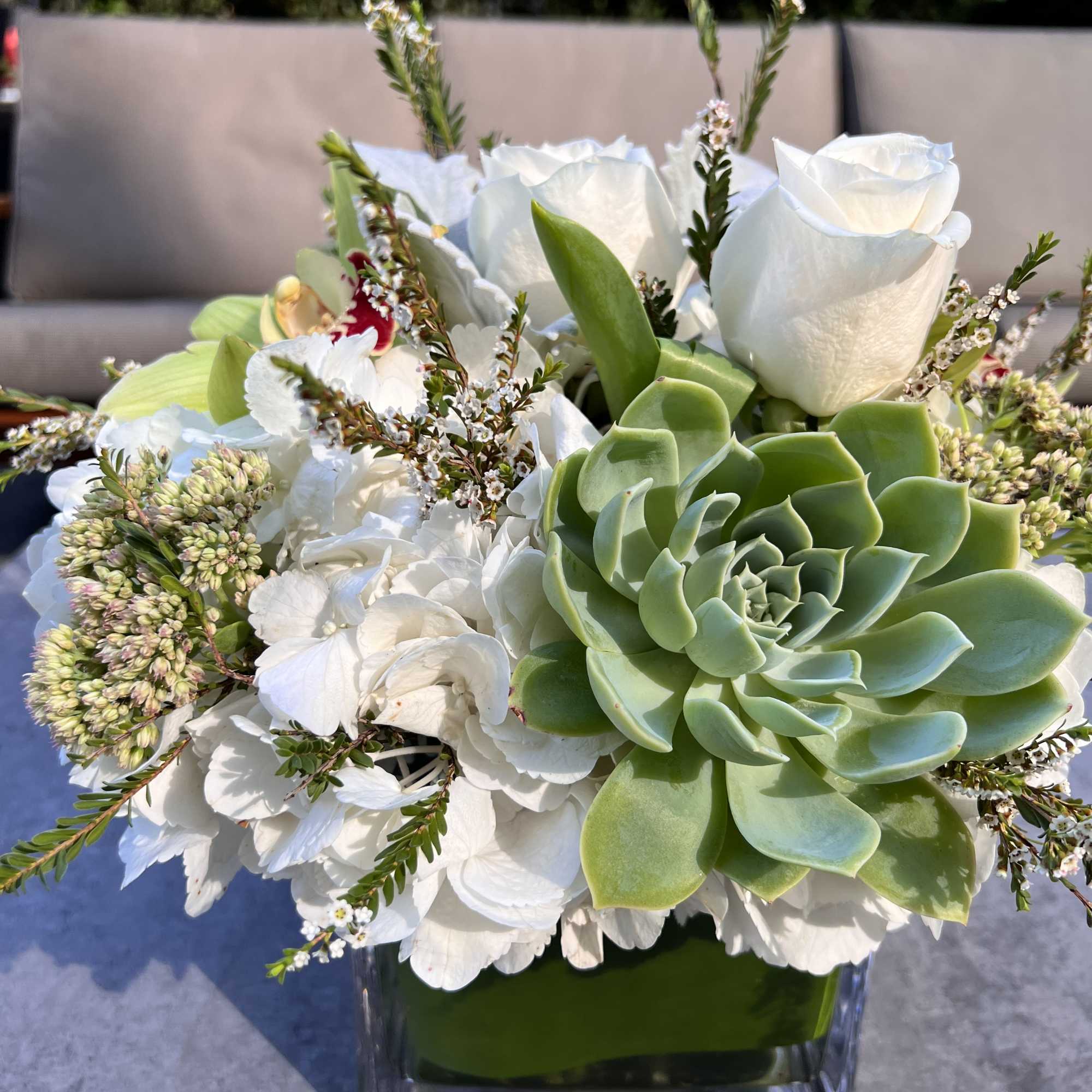 Execusite floral piece created with all natural element&#039;s succulents, greenery&rsquo;s premium cream