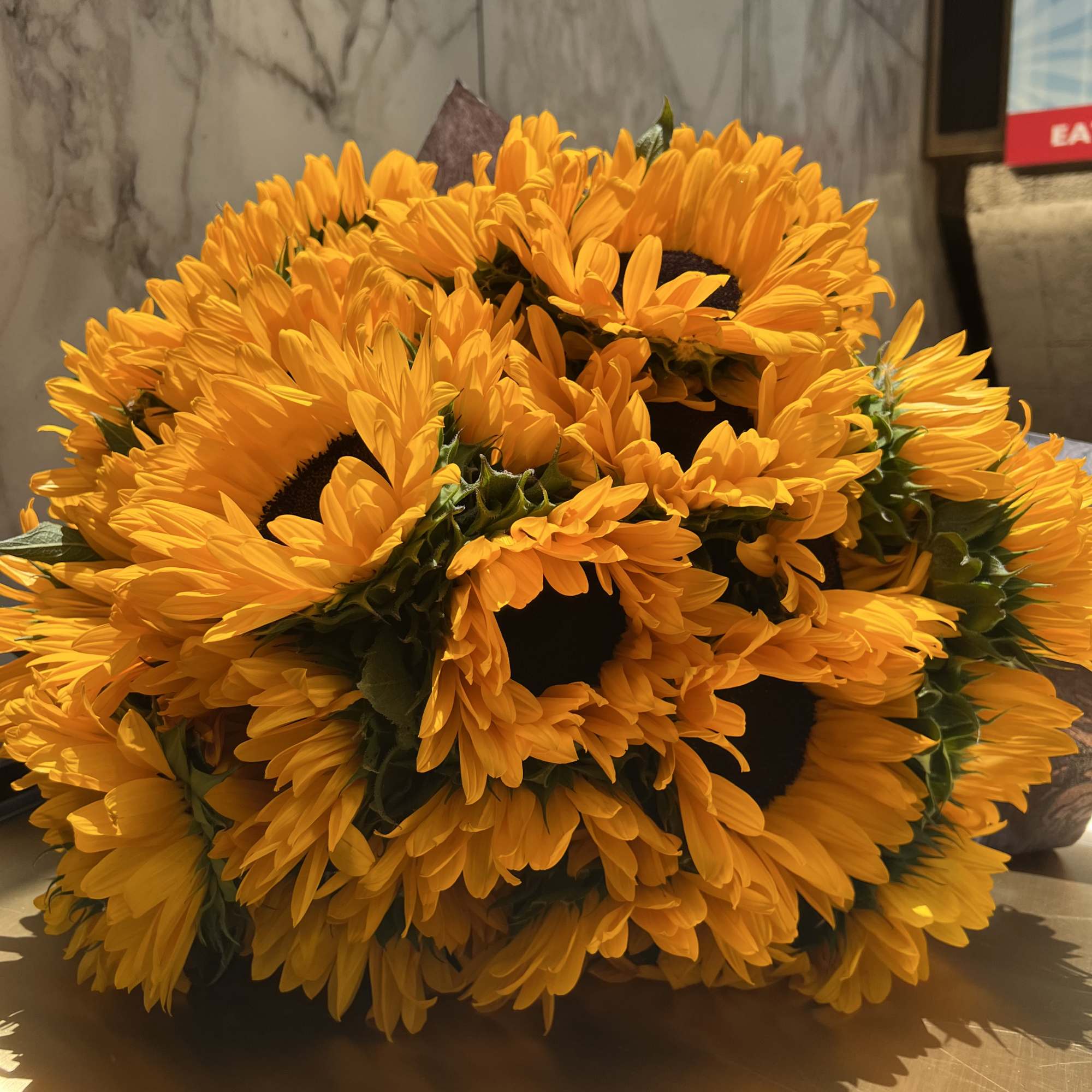 great bouquet of  premium sunflowers wrapped in black paper. Great presentation