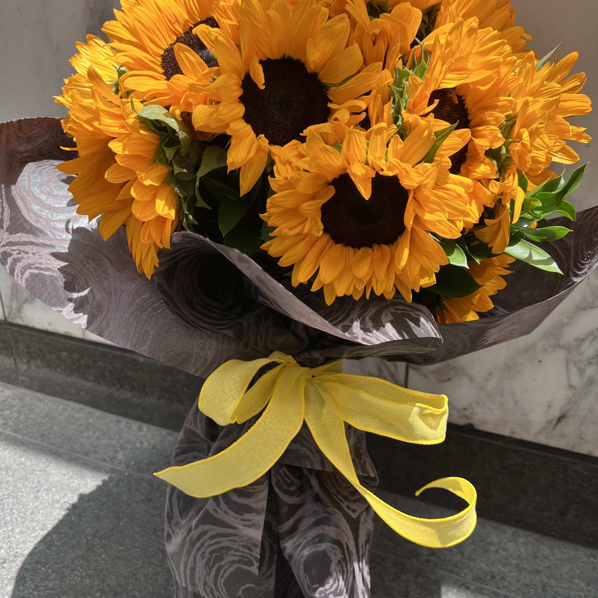 great bouquet of  premium sunflowers wrapped in black paper. Great presentation