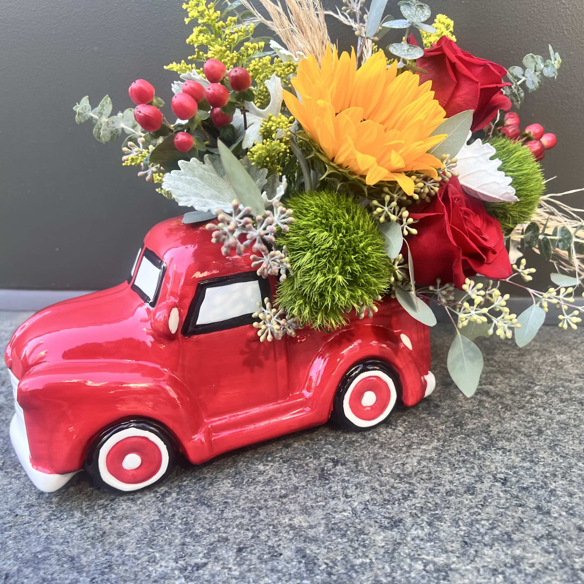A collective ceramic farmers red truck, 11&rdquo; long by 7&rdquo; tall 