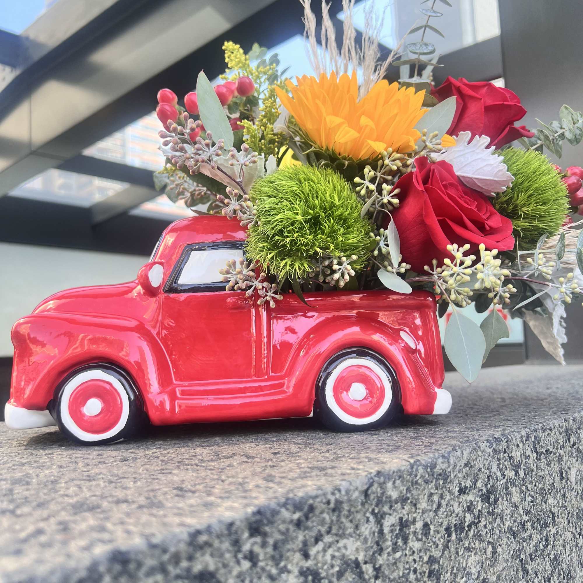 A collective ceramic farmers red truck, 11&rdquo; long by 7&rdquo; tall 