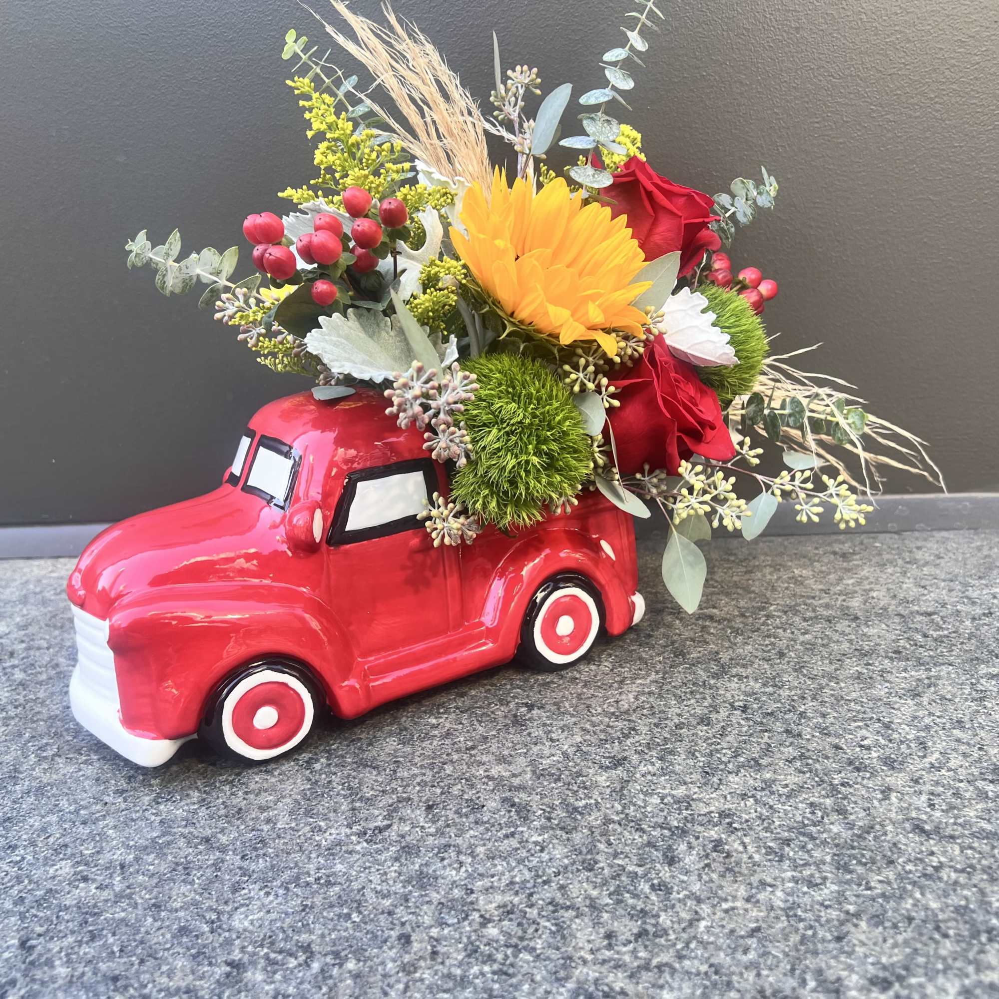 A collective ceramic farmers red truck, 11&rdquo; long by 7&rdquo; tall 