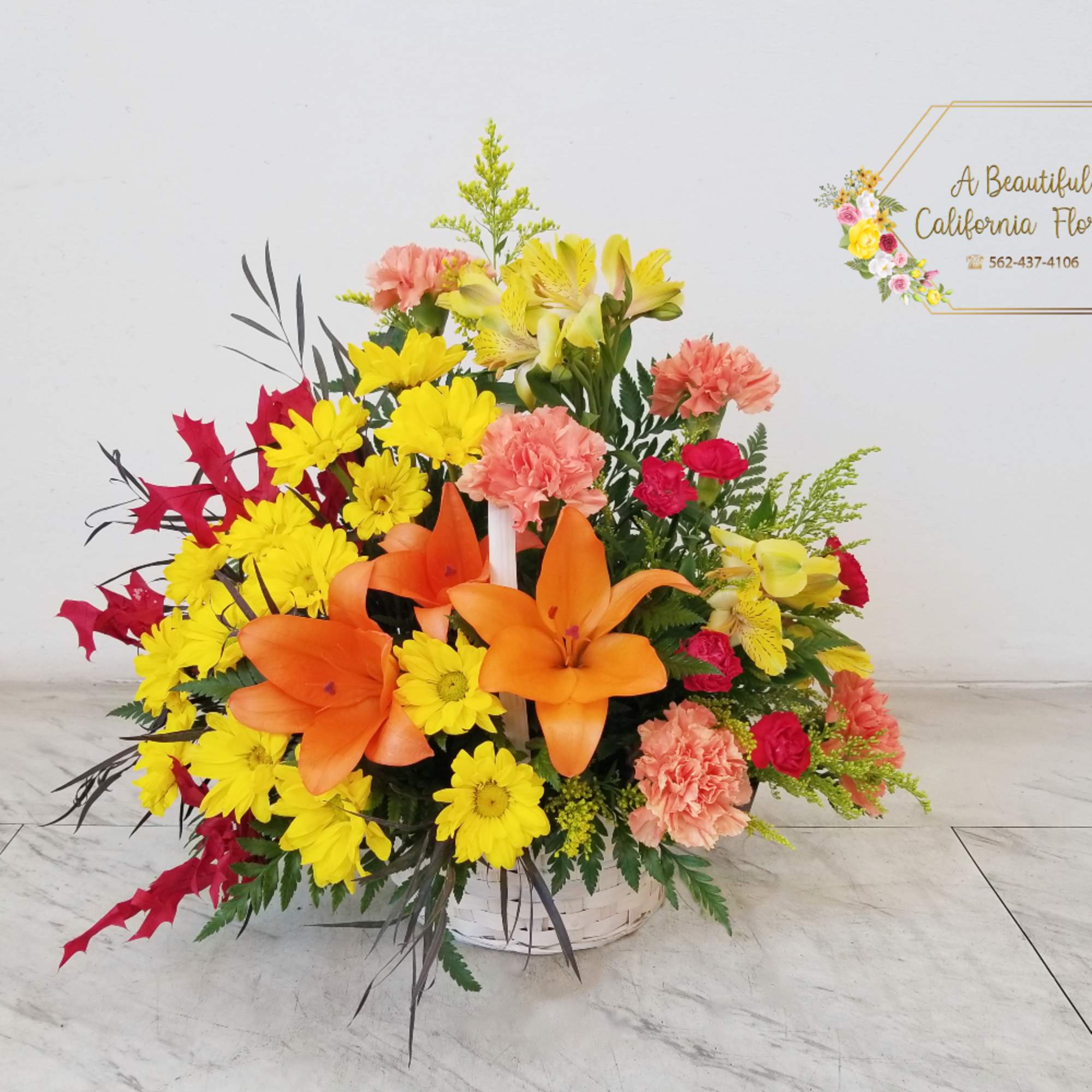 Autumn&#039;s Wonder, a beautiful arrangement of Fall blooms, foliage and textures. Presented