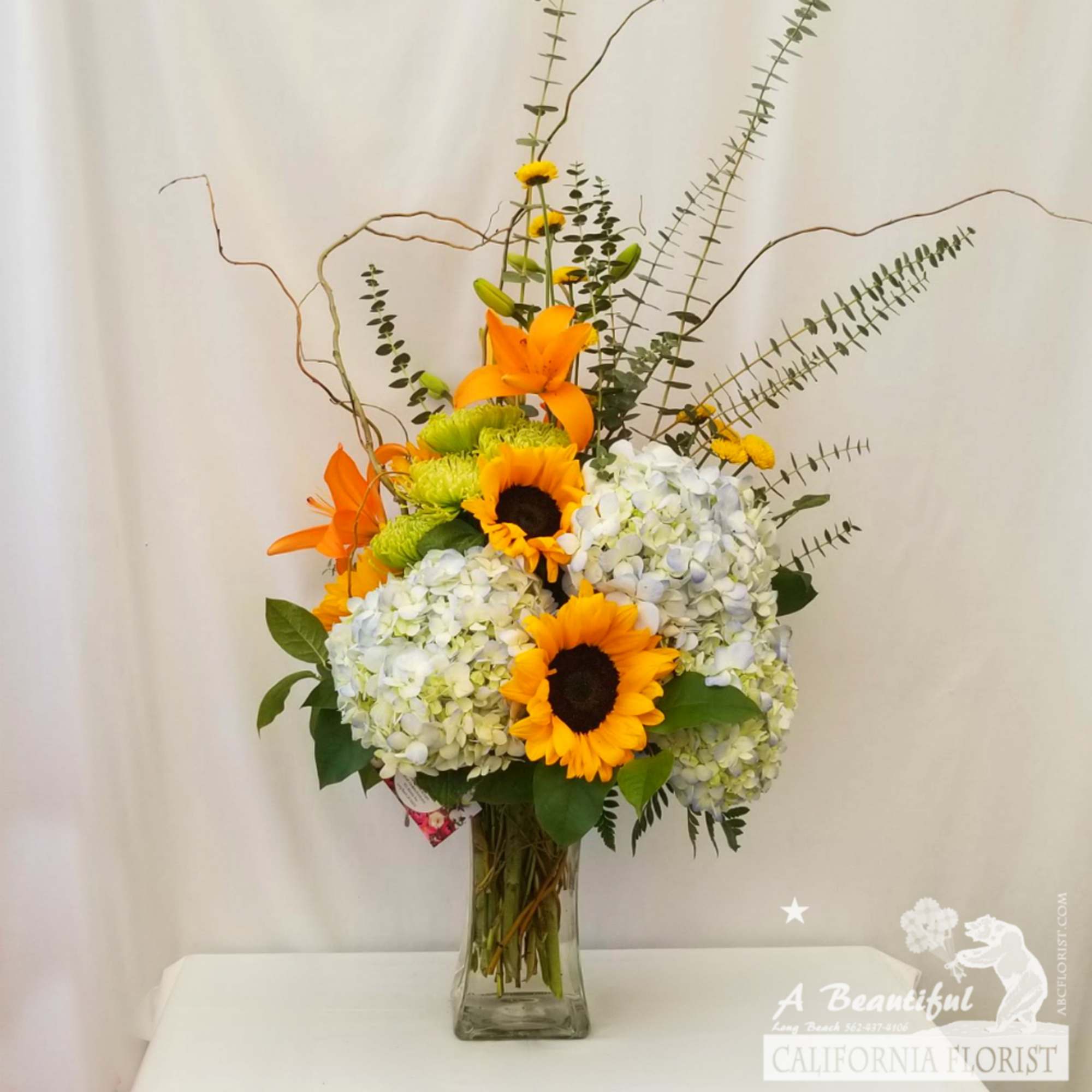 Favorite Gatherings of Sunflowers, Hydrangeas, Lilies and lush greens, accents of spiral