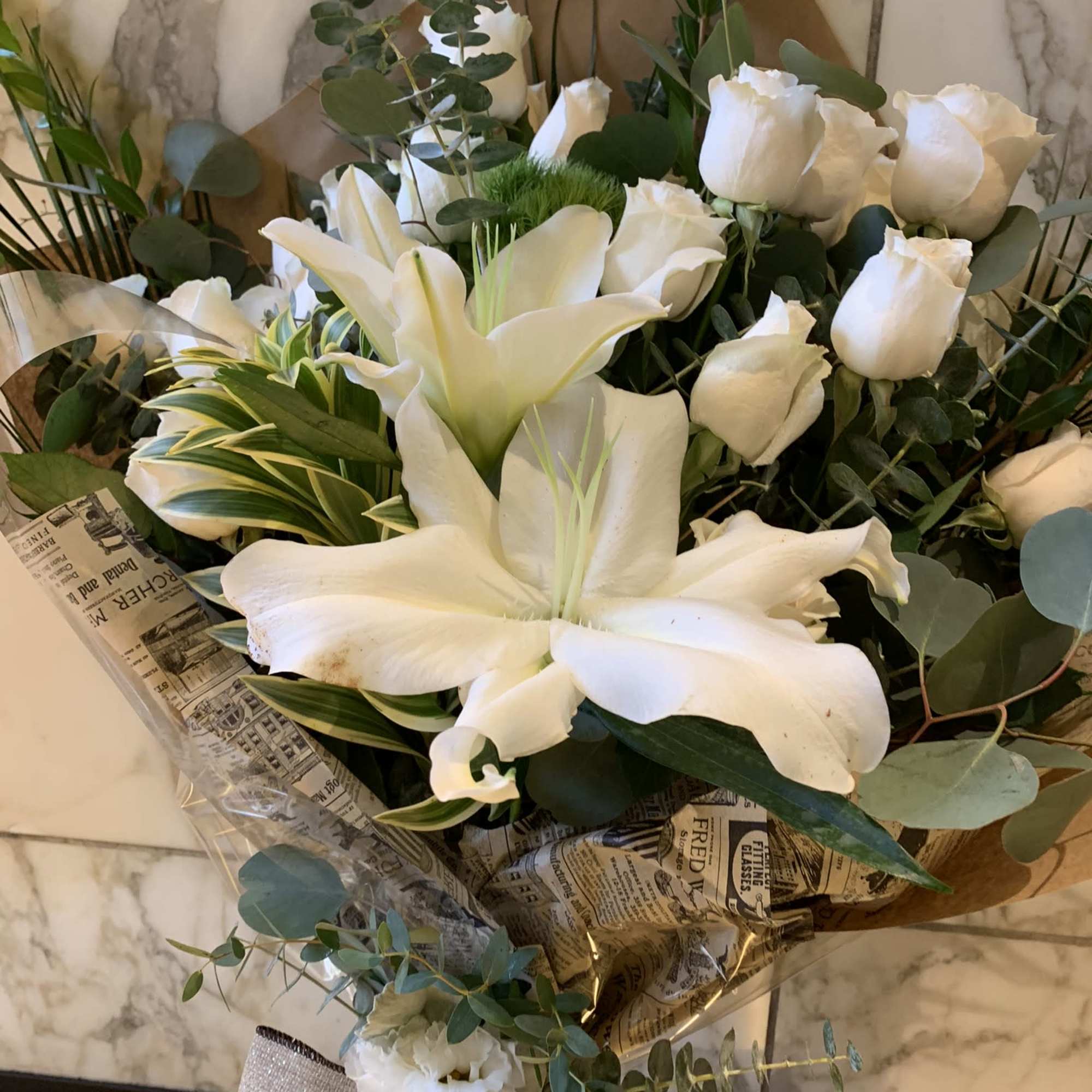 Dozen white roses in a beautiful wrapped presentacion