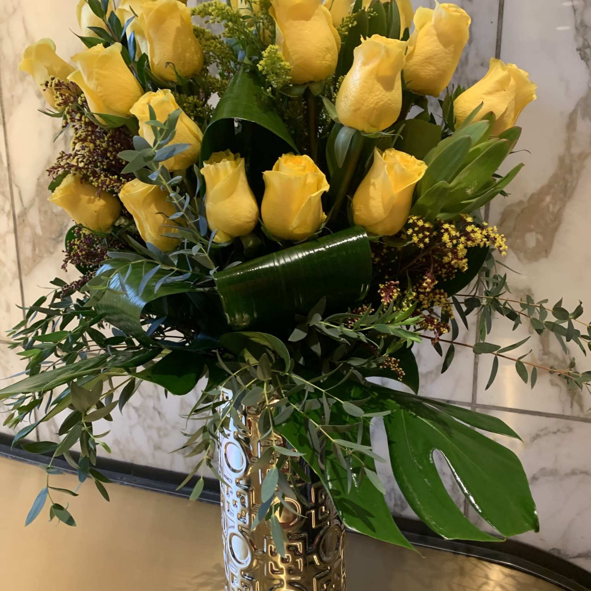 One of our Newest Design 2 dozen long stem Roses in a