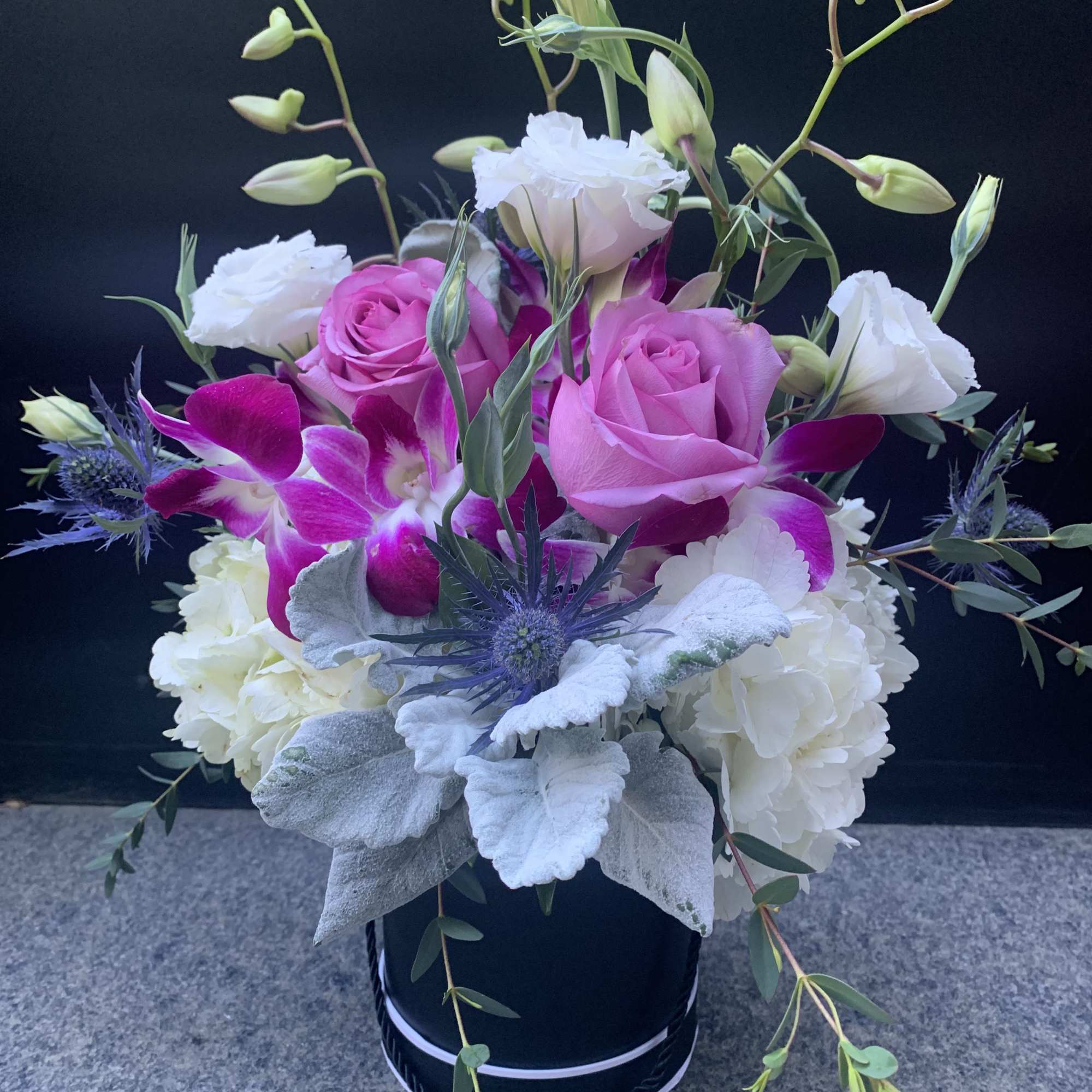 Ceramic Container filled with flowers roses, Hawaiian orchids, hydrangeas, dusty miller, Tiso