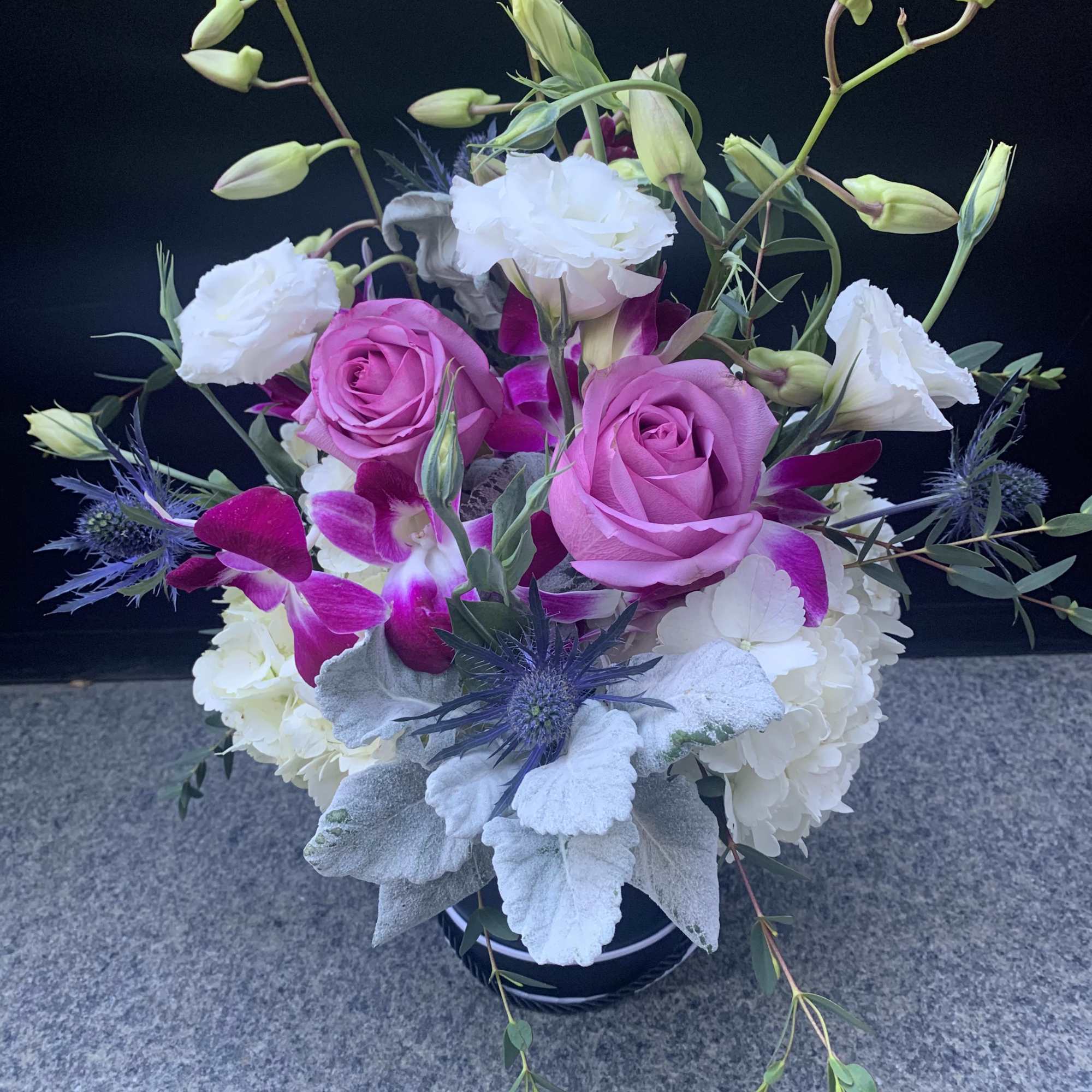 Ceramic Container filled with flowers roses, Hawaiian orchids, hydrangeas, dusty miller, Tiso
