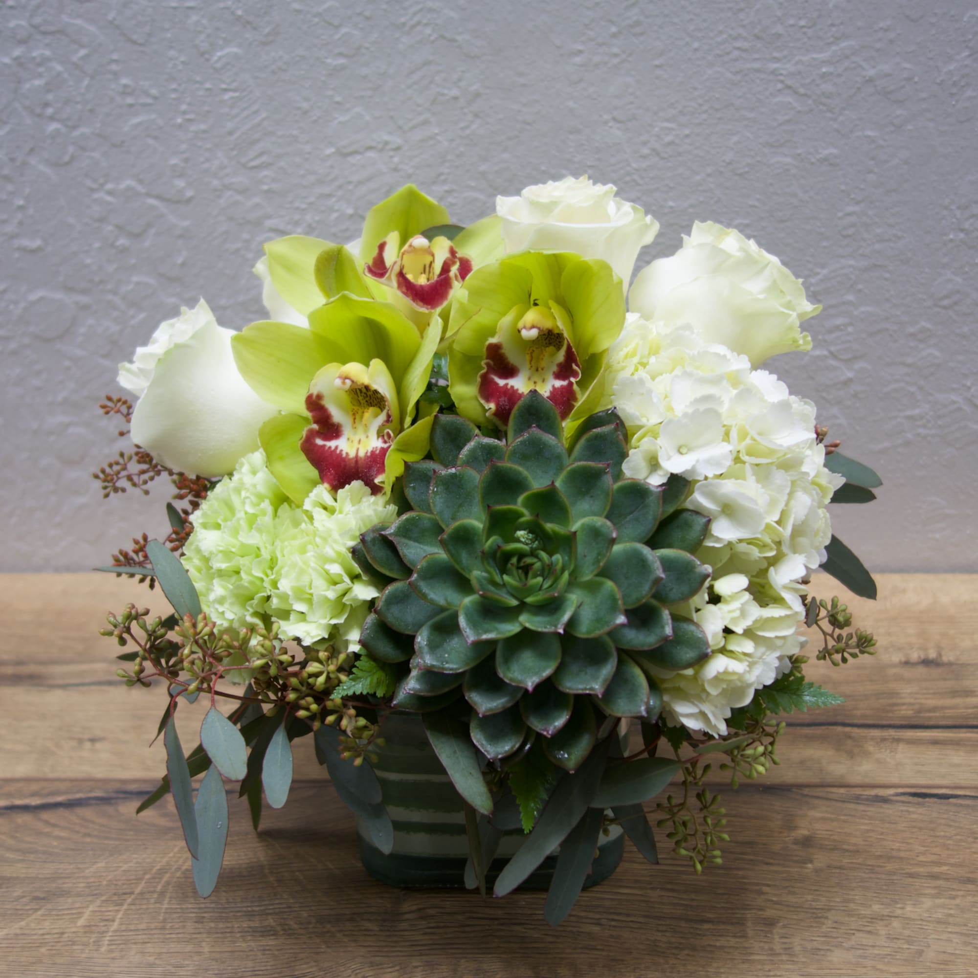 The green abundance of the rainforest is captured in this lovely bouquet