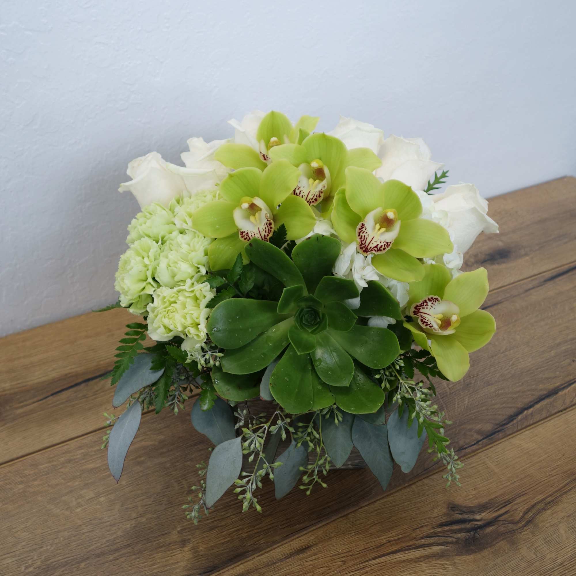 The green abundance of the rainforest is captured in this lovely bouquet