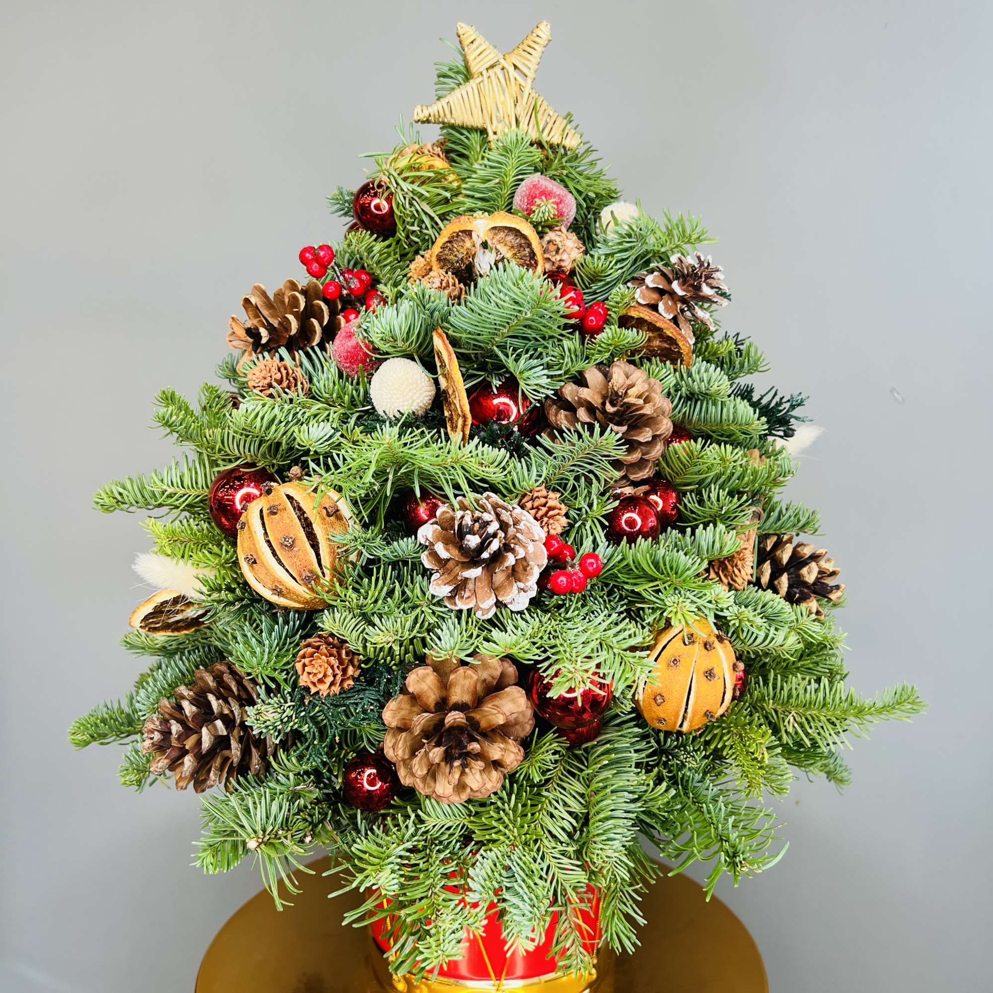 Natural, handcrafted mini Christmas tree with the lights and decorations. 
H 20&quot;