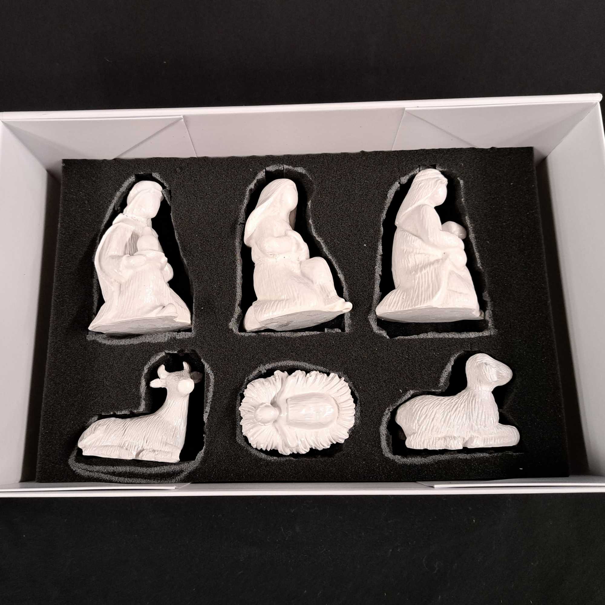 This beautifully hand-painted Nativity set features the Holy Family, Wise Men, shepherds