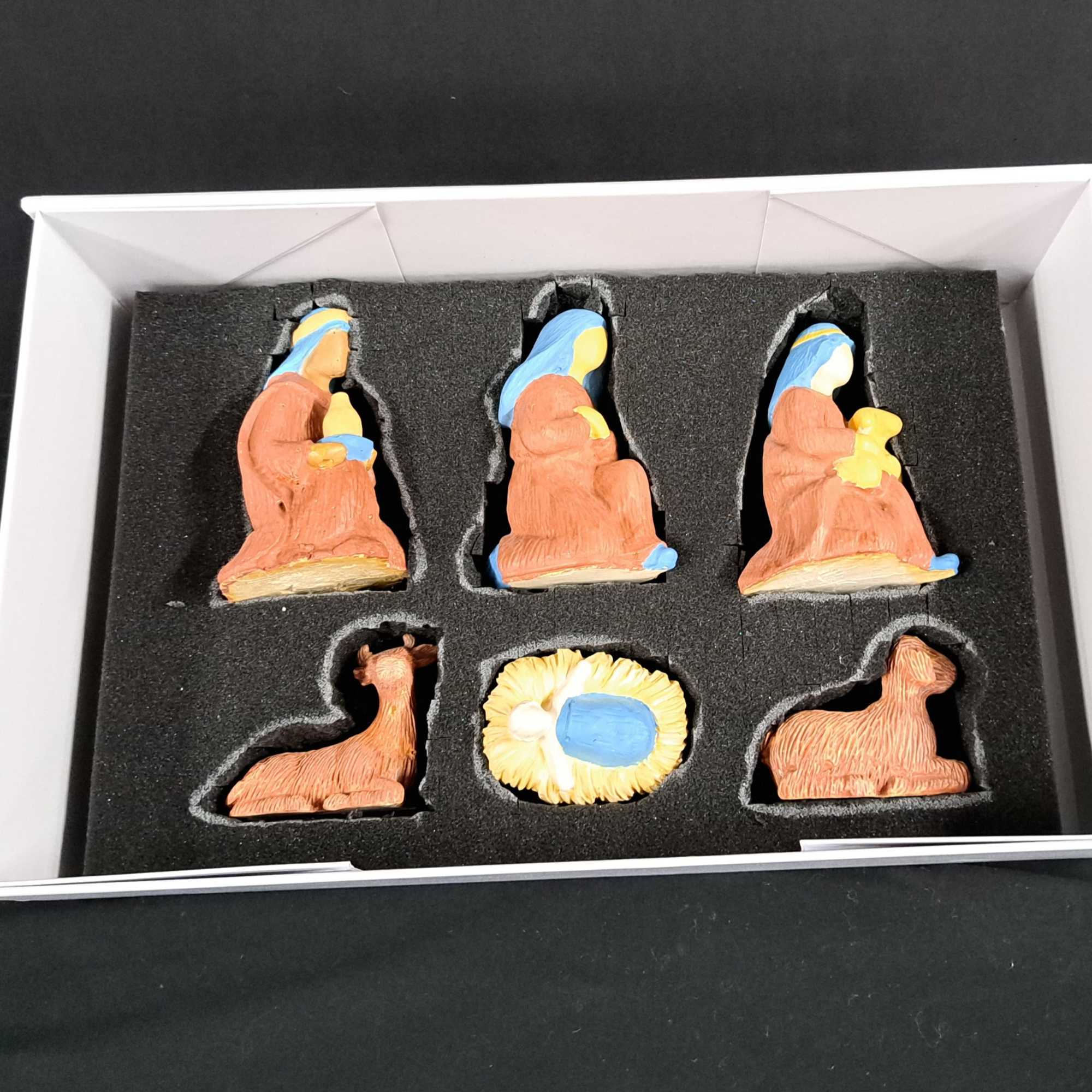 This beautifully hand-painted Nativity set features the Holy Family, Wise Men, shepherds
