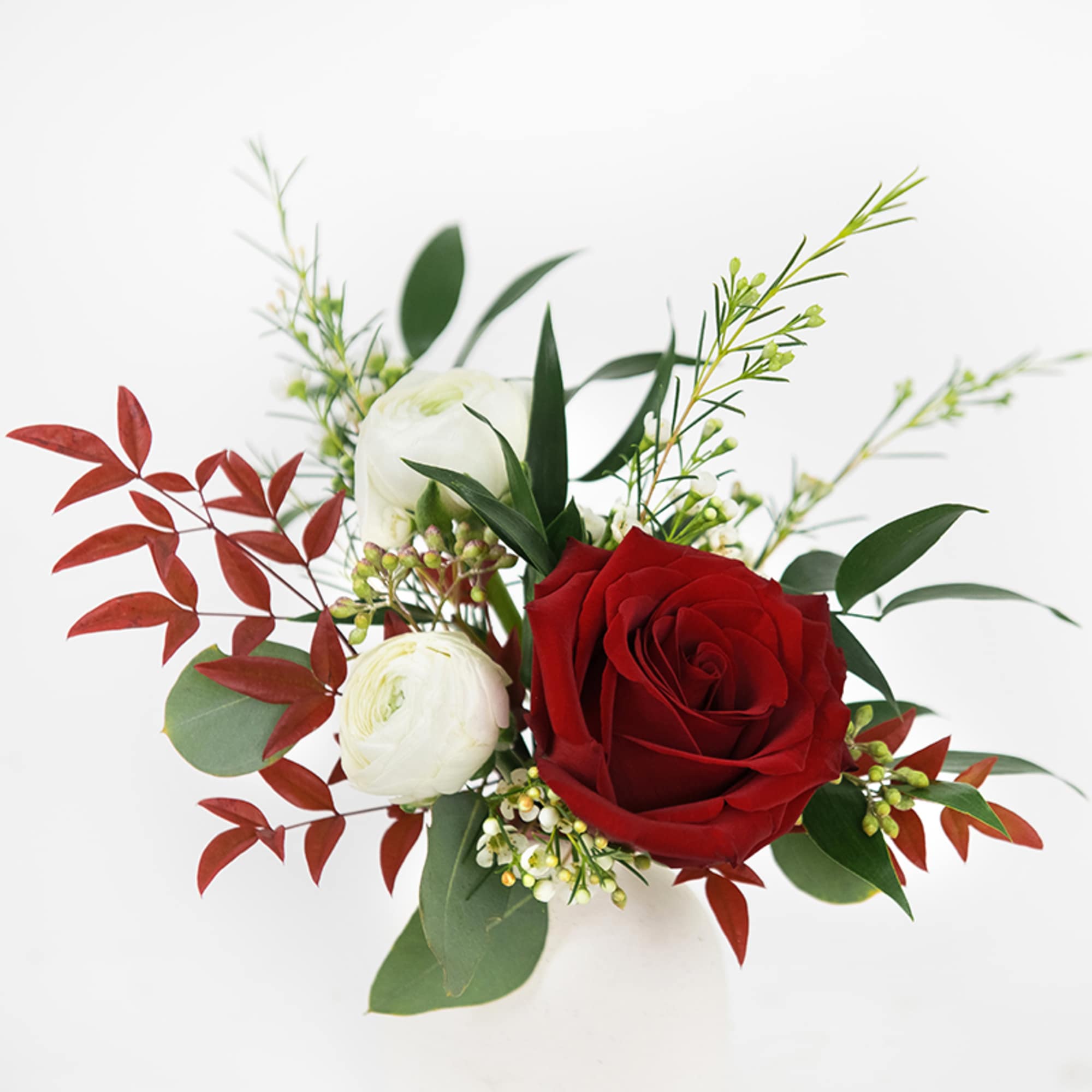 Style your holiday table in a set of Ivory Ceramic bud vases