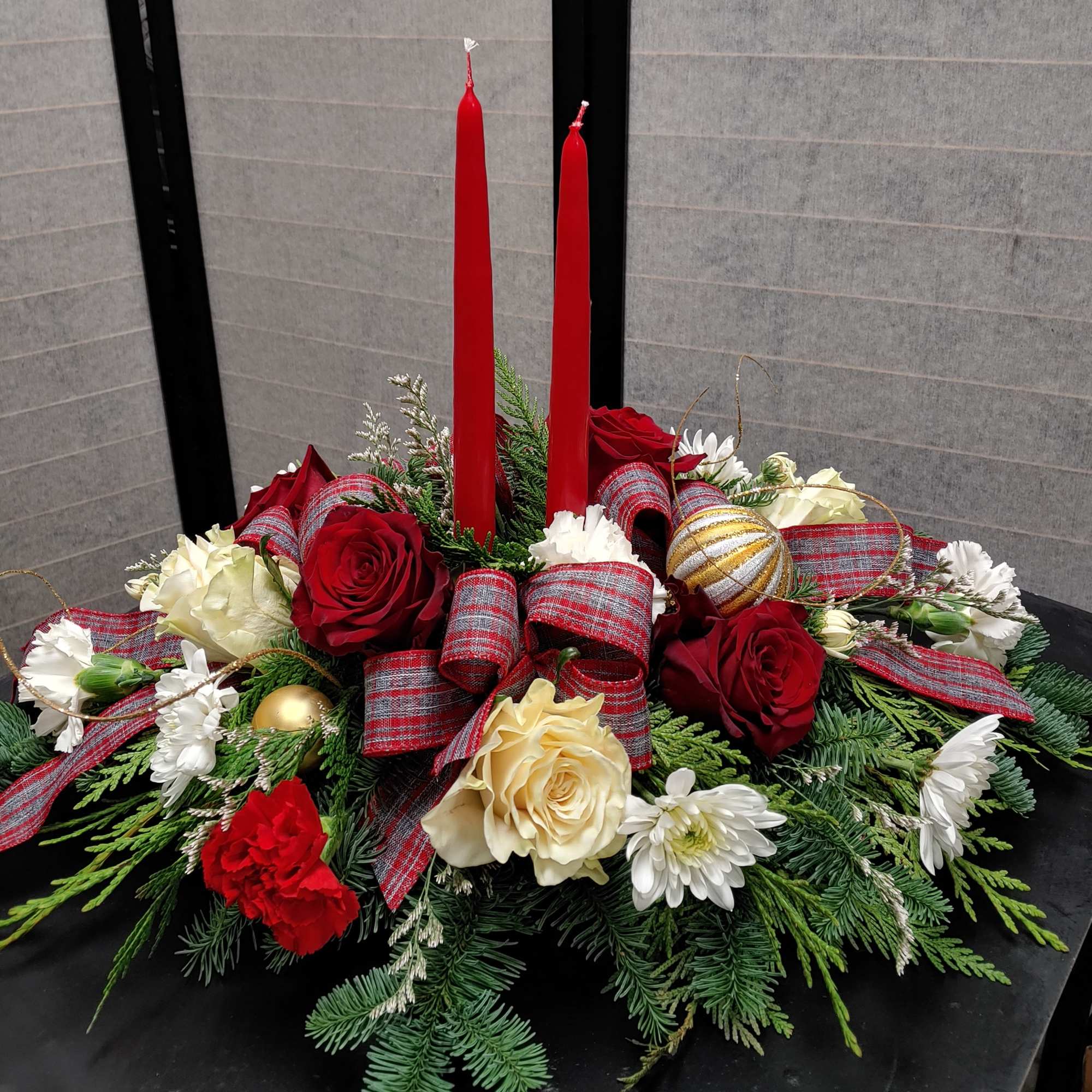 Timeless elegance is everything in this holiday centerpiece. 2 candles, noble fir