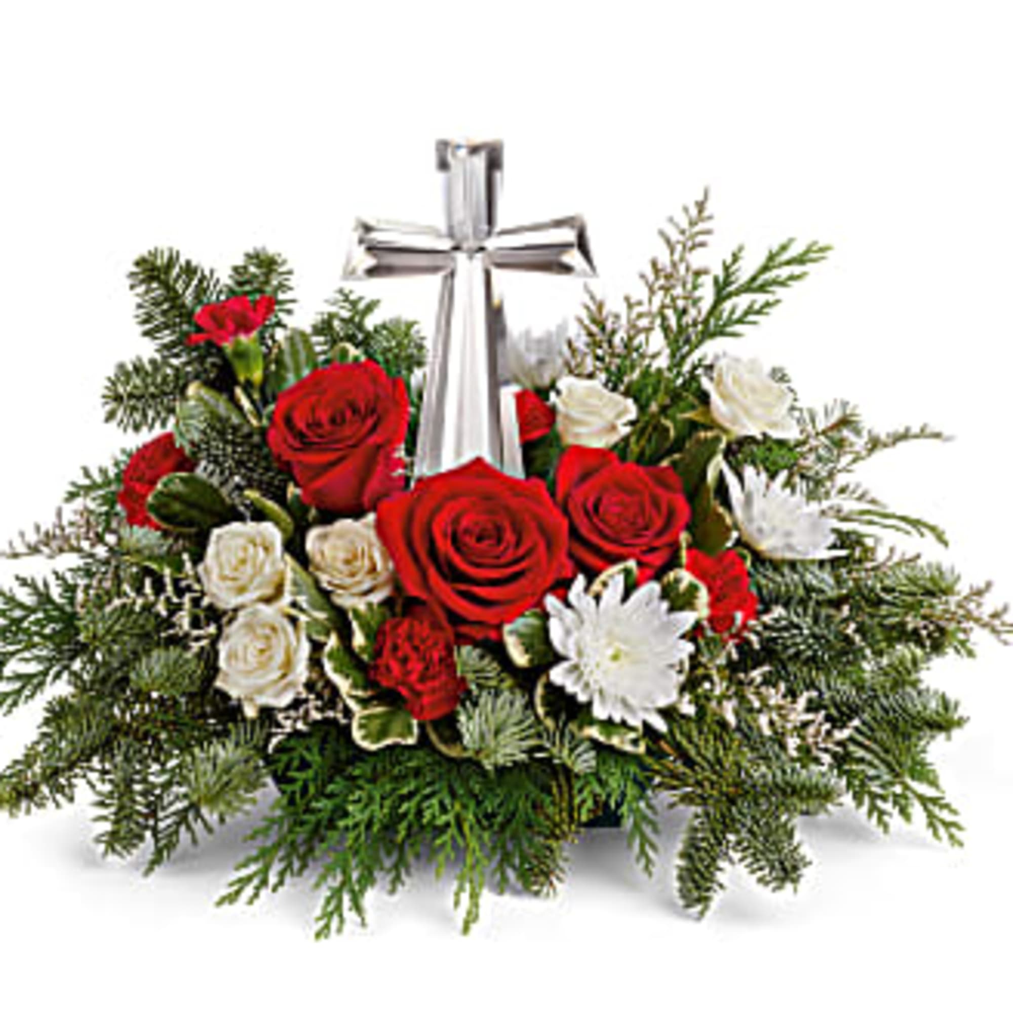 The crystal cross is nestled elegantly among red and white blooms, this