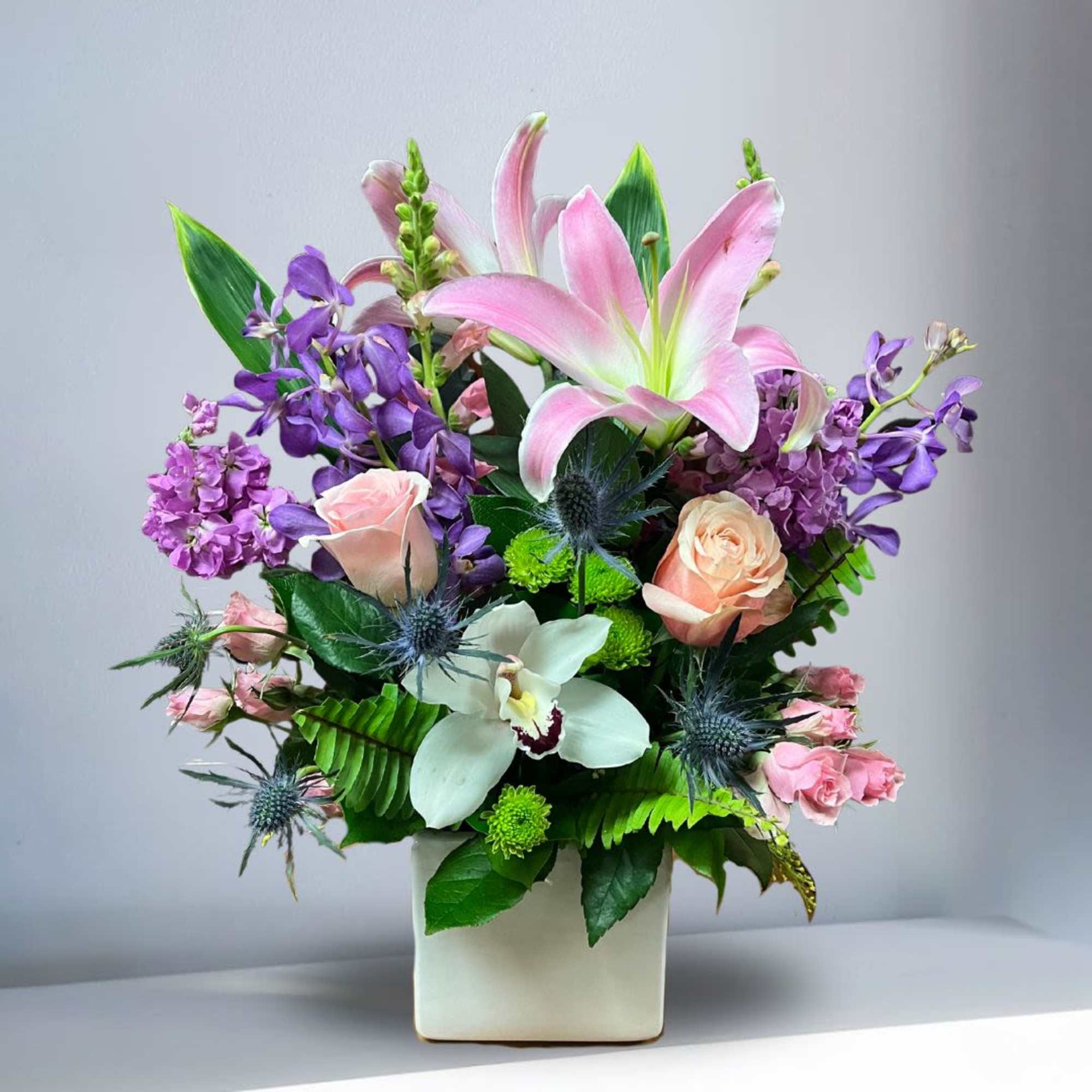 Recipe: Stargazer Lilies, Peach Roses, Pink Spray Roses, Purple Orchids, Purple Stock