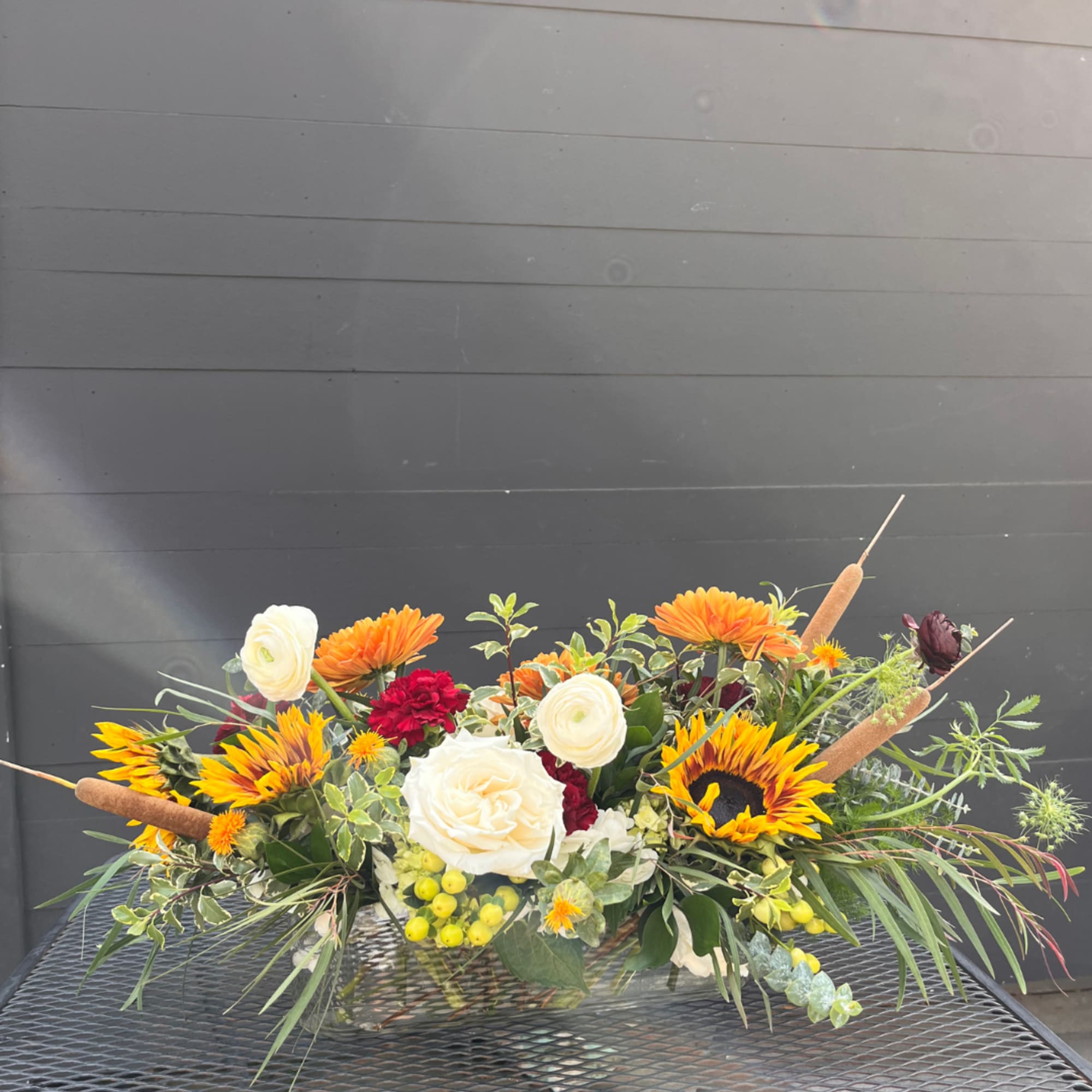 Our Thanksgiving Centerpiece is a thoughtfully curated, low-profile arrangement designed to elevate