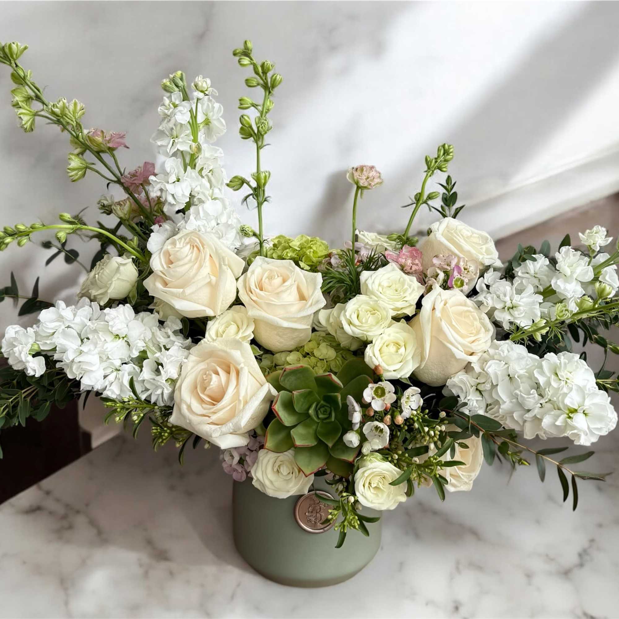 Elegant and enchanting, Whimsical Whites is a dreamy arrangement of delicate white