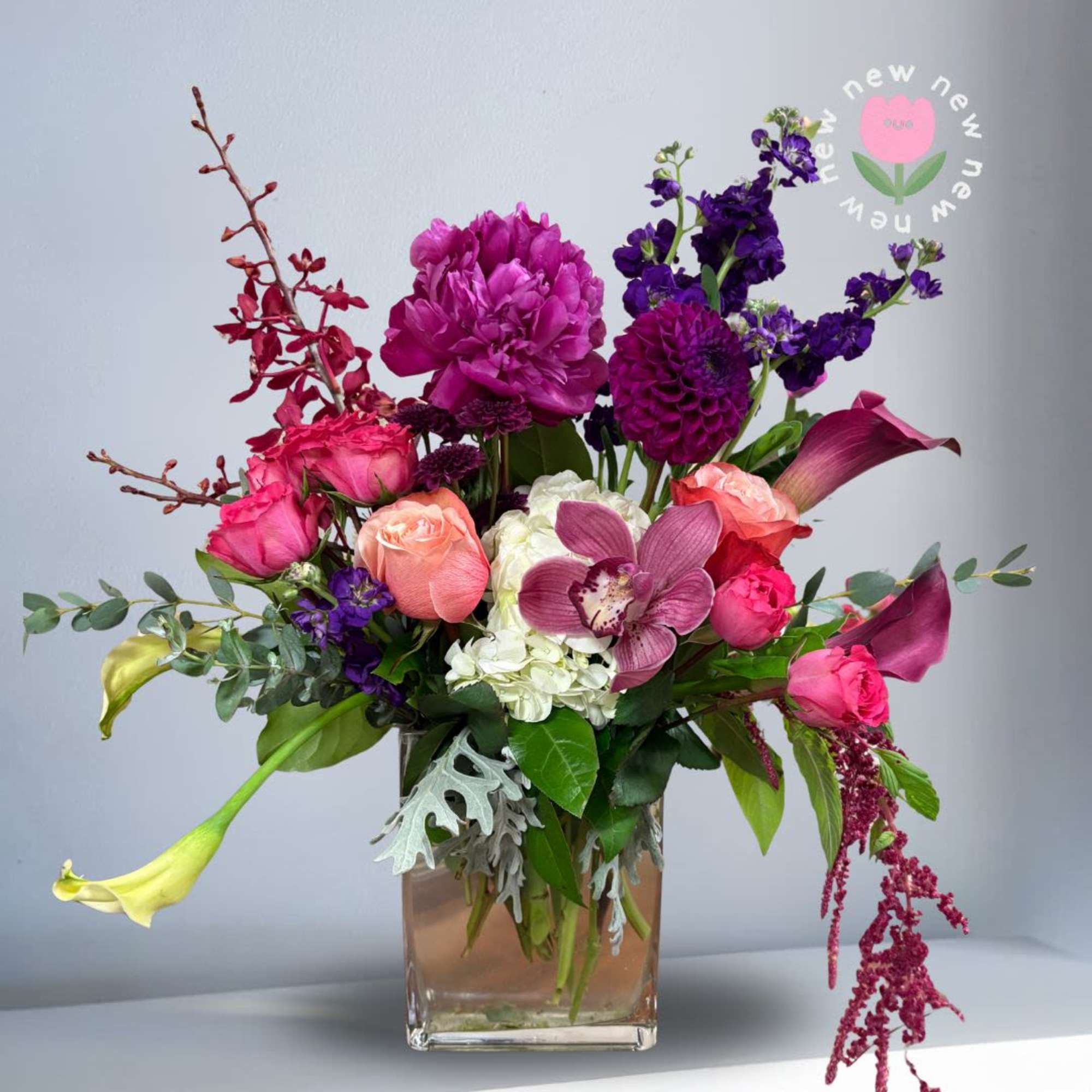 This lush and vivid arrangement contains all premium flowers that will blow
