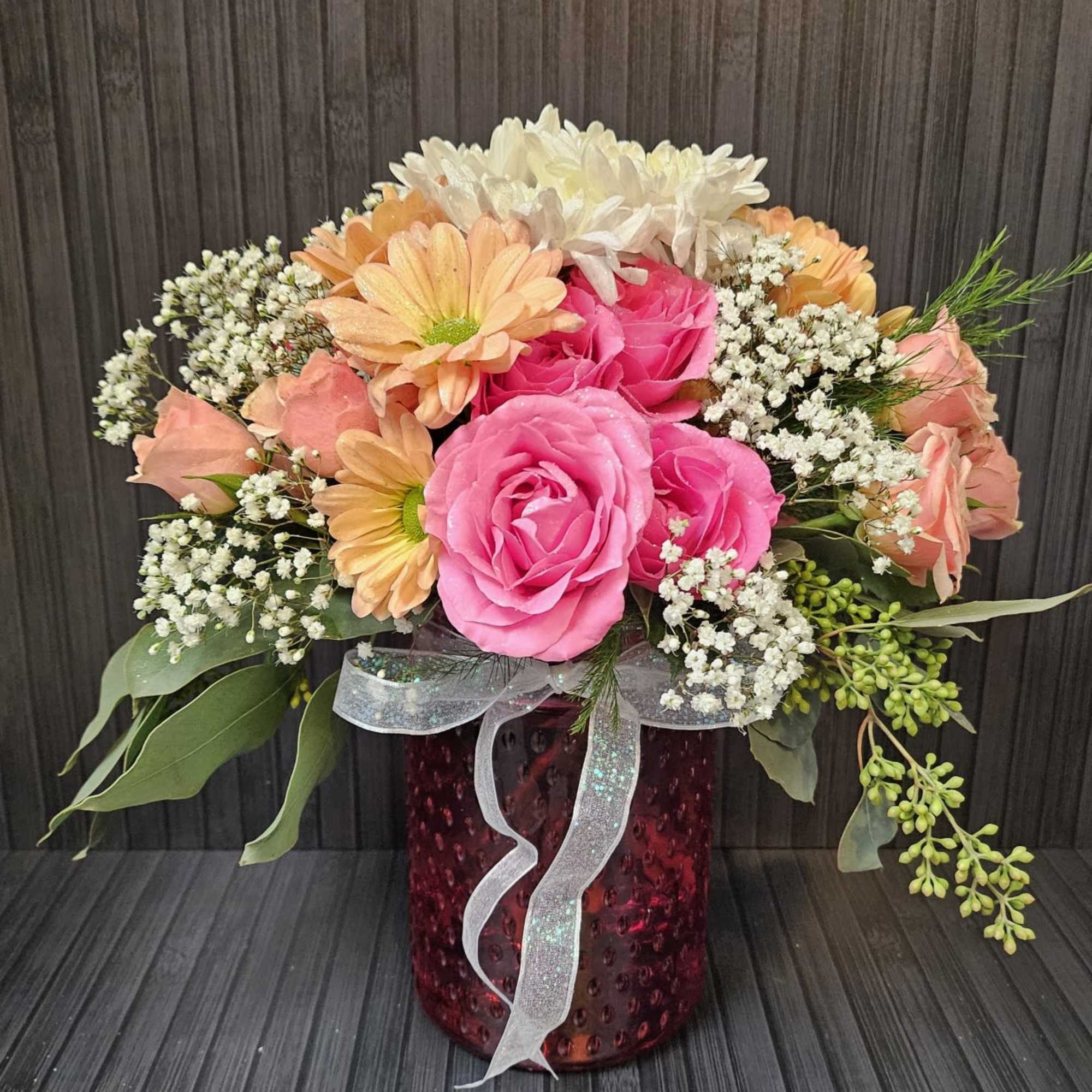 Simple Sparkled Daisies and spray roses in a sweet knobby vase. Simple
