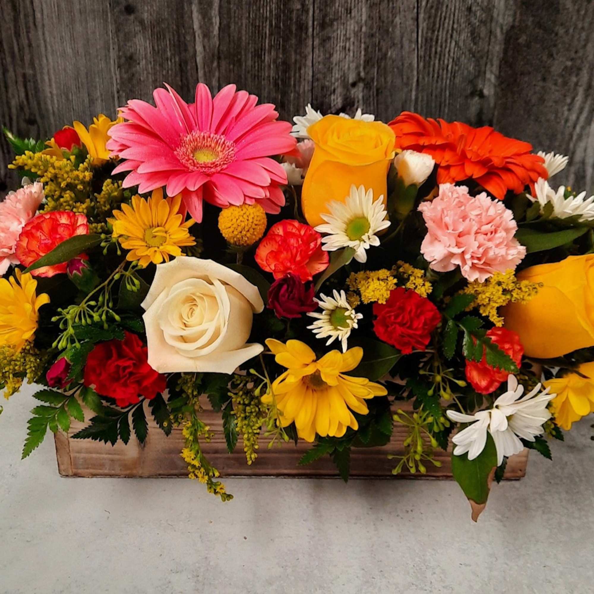 Keep things fun with this jewel toned flower box! Our most seasonal