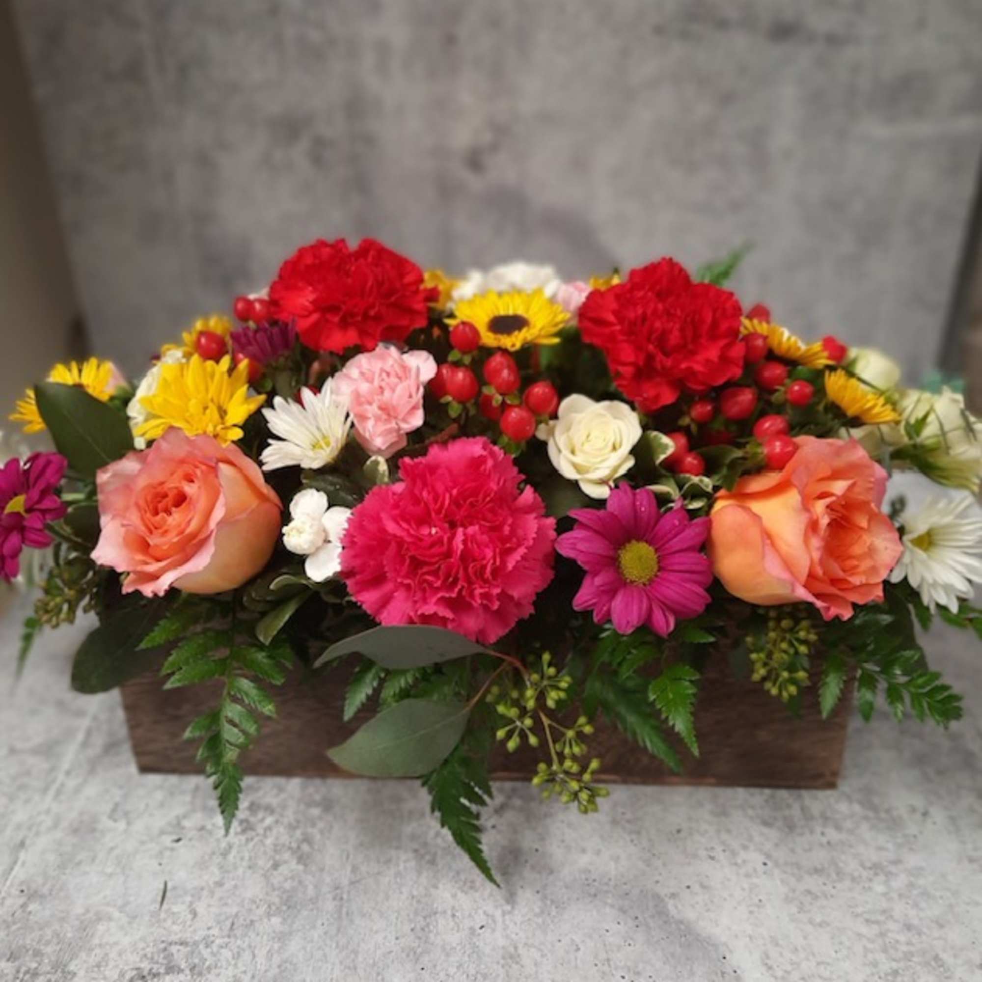 Keep things fun with this jewel toned flower box! Our most seasonal