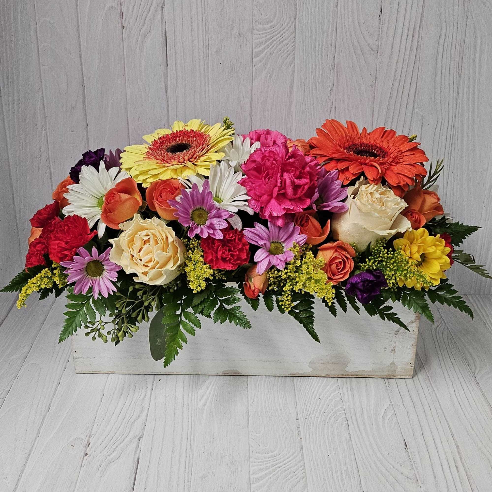 Keep things fun with this jewel toned flower box! Our most seasonal