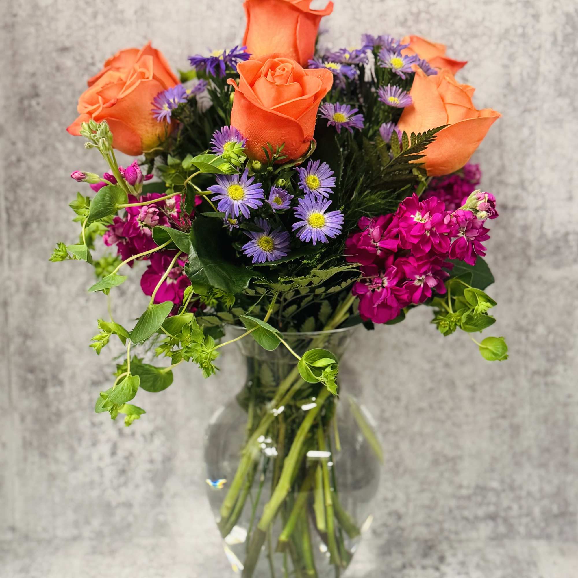 Celebrate good times with this lively bouquet. The arrangement includes roses, stock