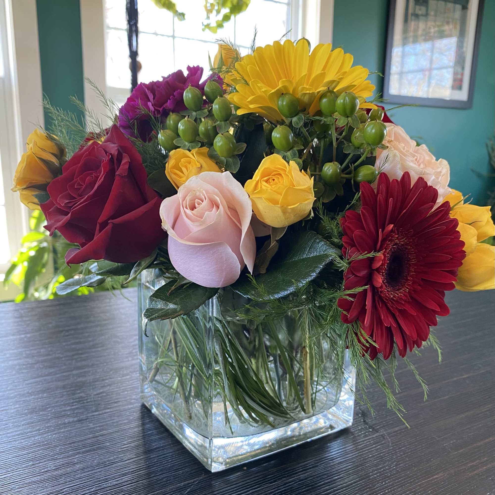 Delight someone special, including yourself, today! Featuring in season roses, Gerbera daisy