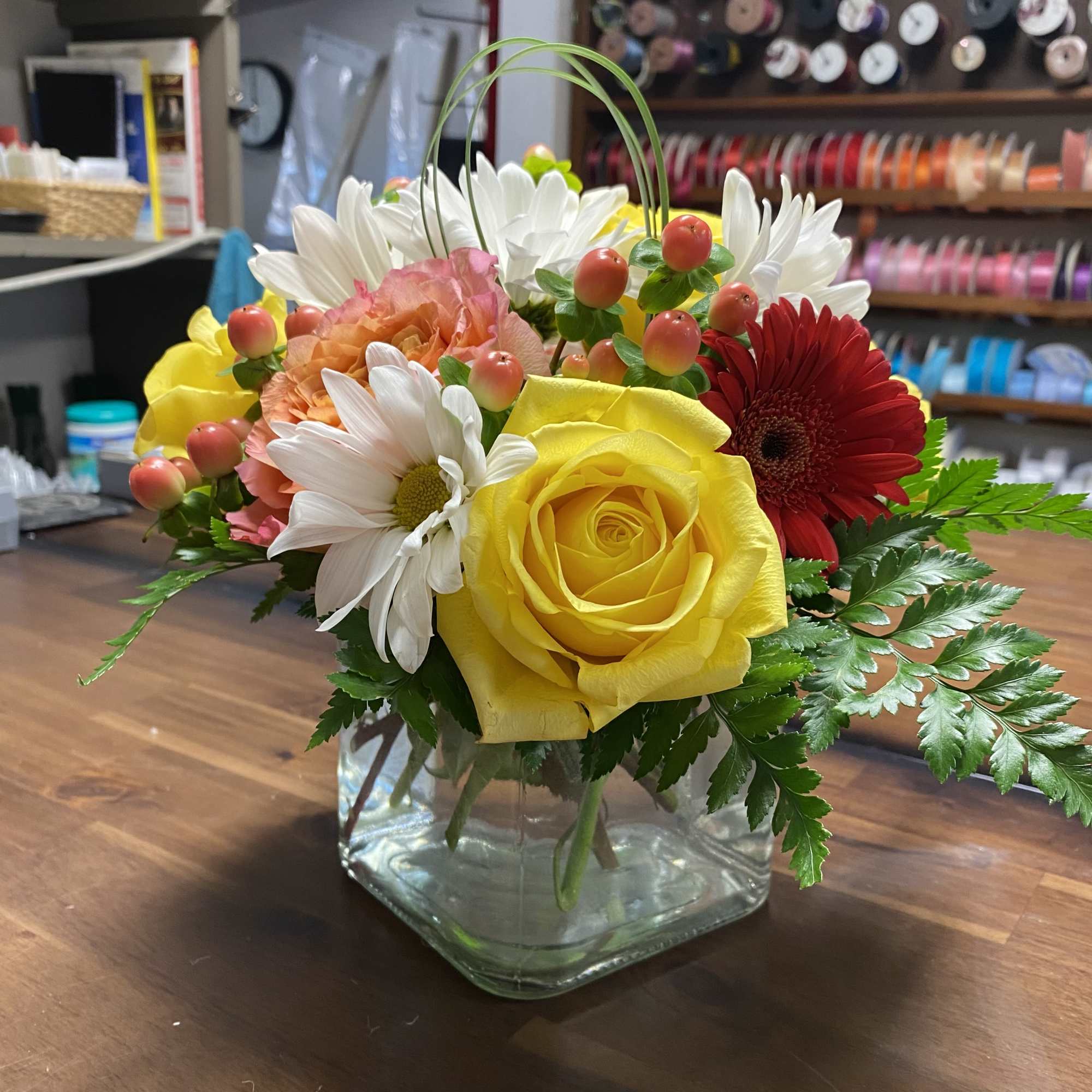 Delight someone special, including yourself, today! Featuring in season roses, Gerbera daisy